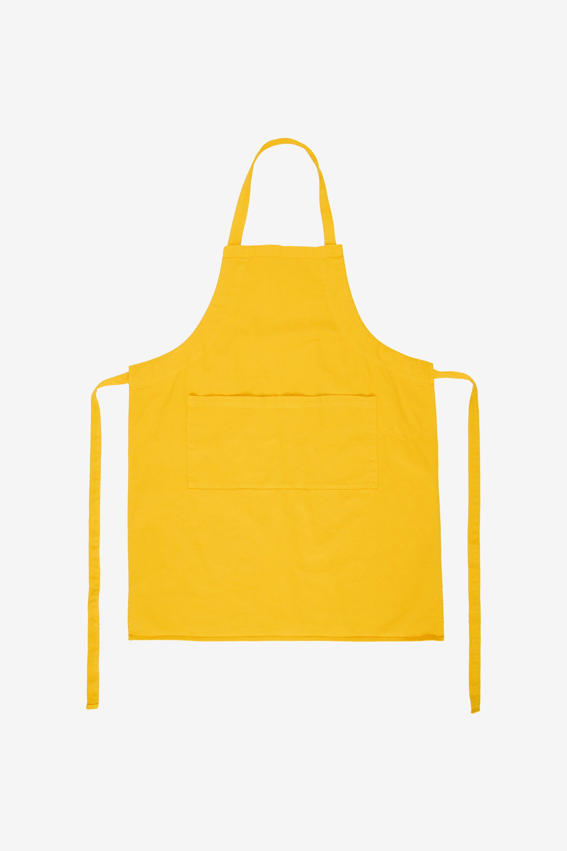Flat lay with straps untied and to the sides of the apron.