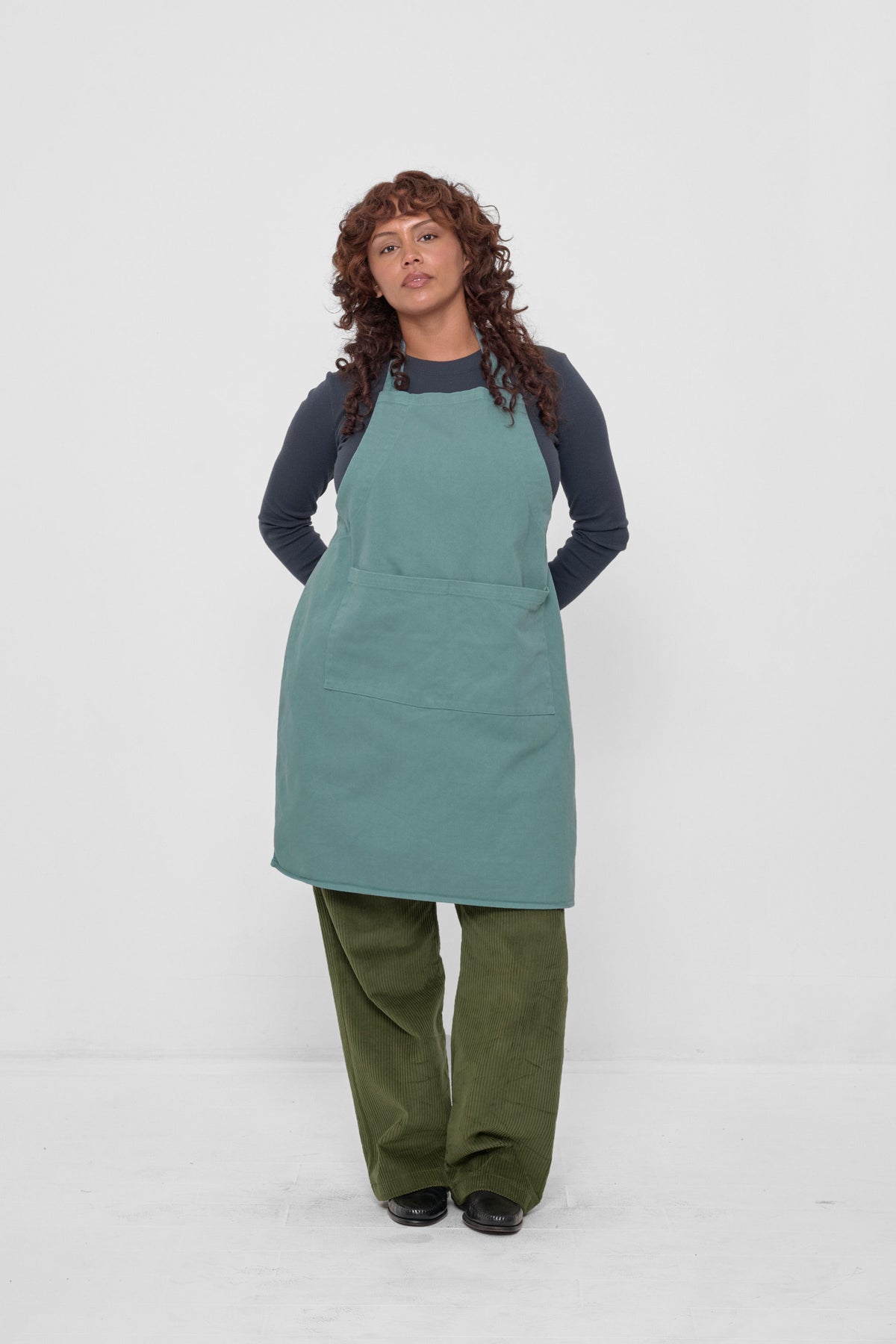 Adjustable Apron in Oyster – styled with Olive Cord Pants, and Slate Rib Long Sleeve.