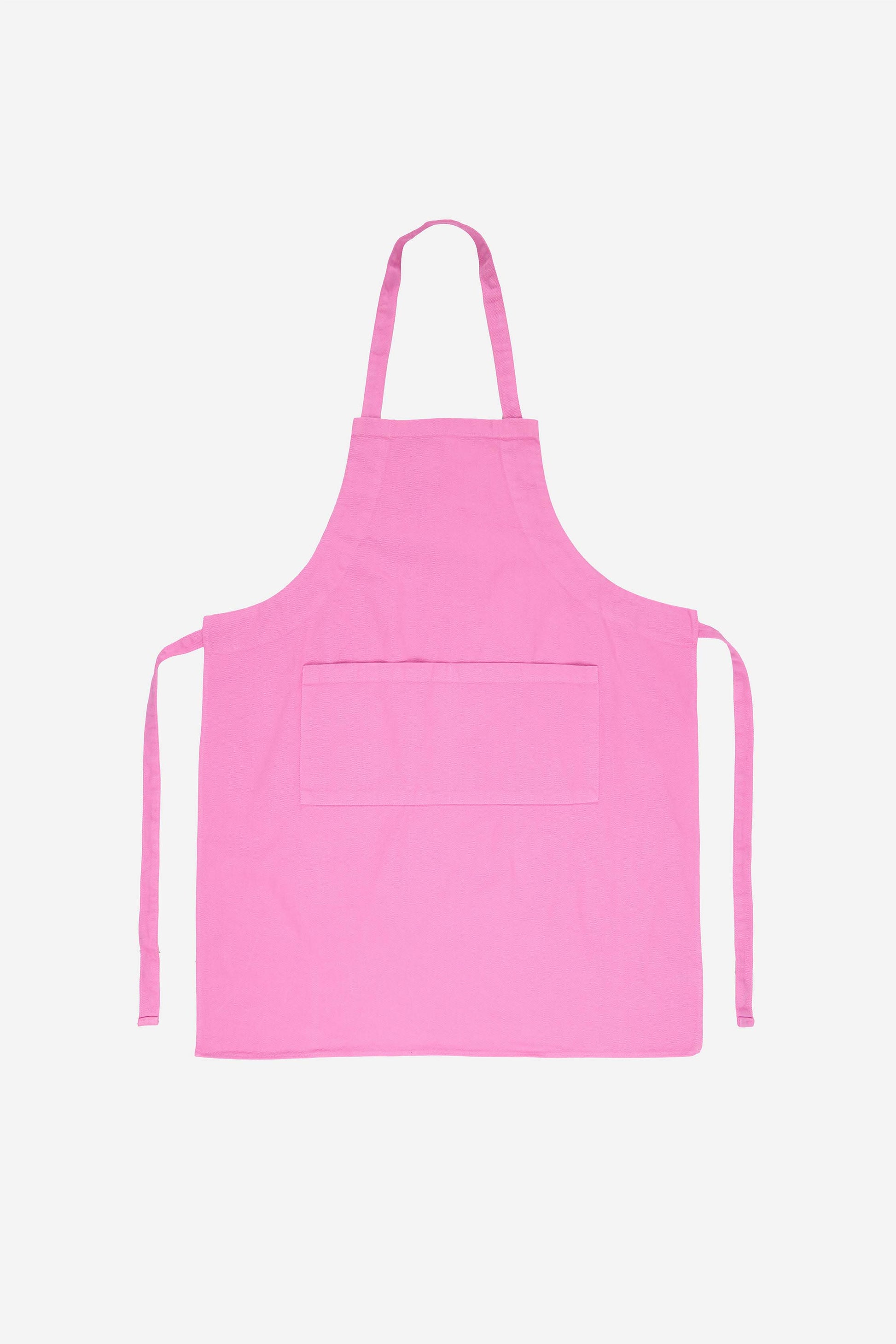 Flat lay of Adjustable Apron in Pixie with straps untied positioned to the sides of the apron.