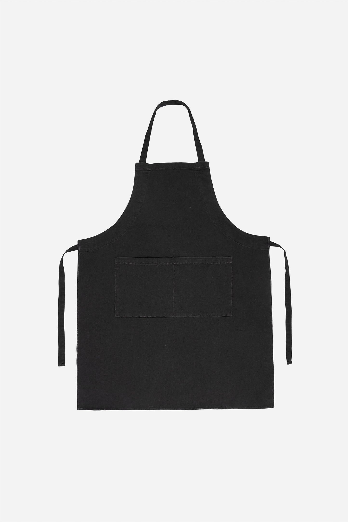 Flat lay with straps untied and to the sides of the apron.