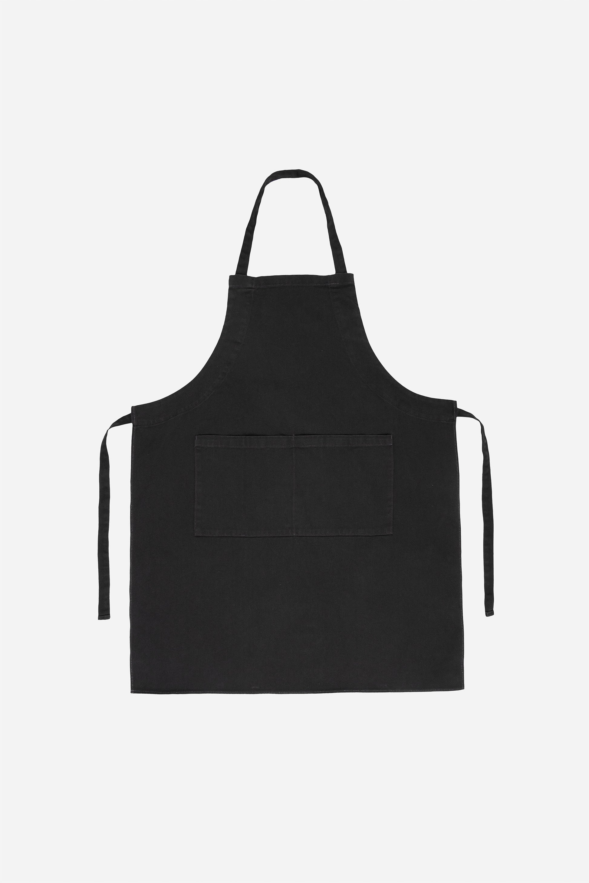 Flat lay with straps untied and to the sides of the apron.