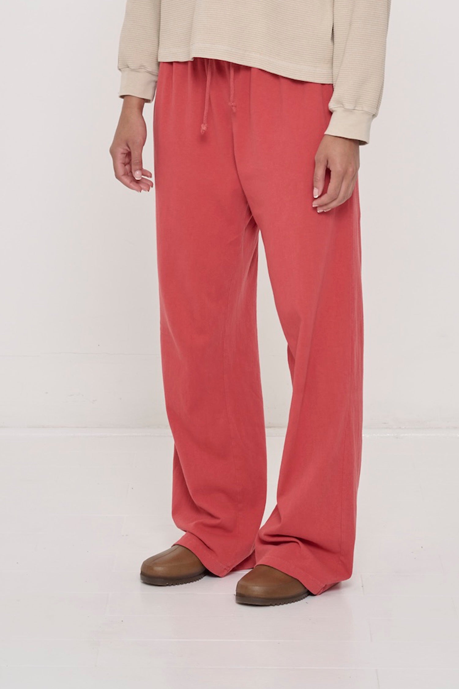 Person facing 45-degrees to the front in Cedar Apartment Pants, showing inseam and outseam.
