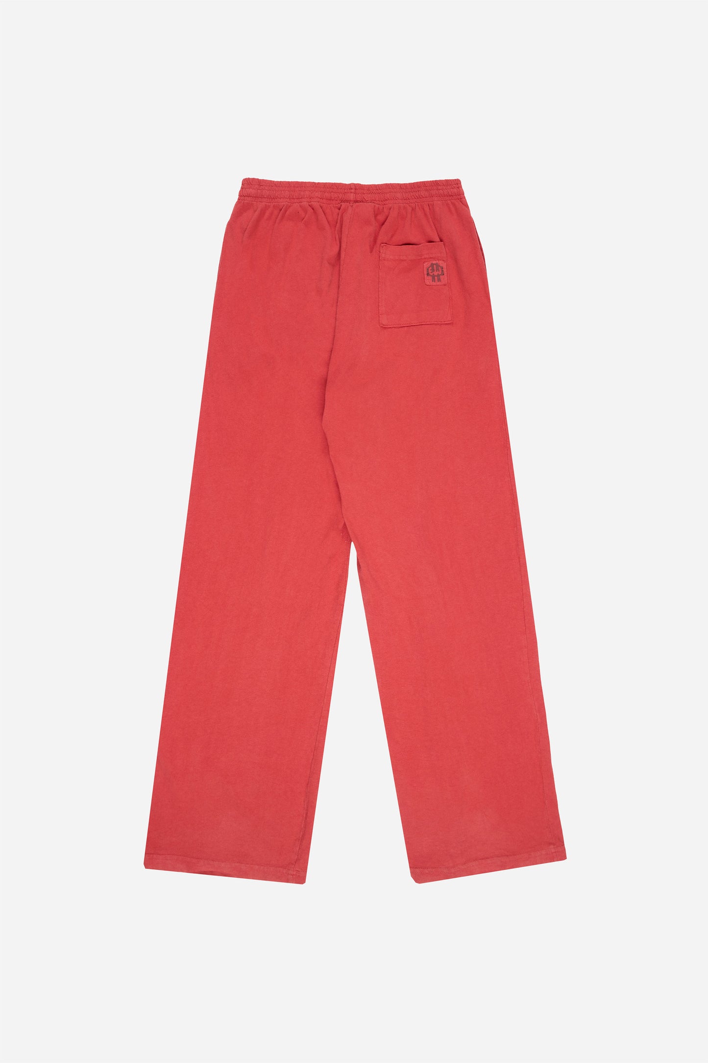Flat lay of Jerico's Apartment Pants in Cedar red, showing the back of the leg and the pocket detail.
