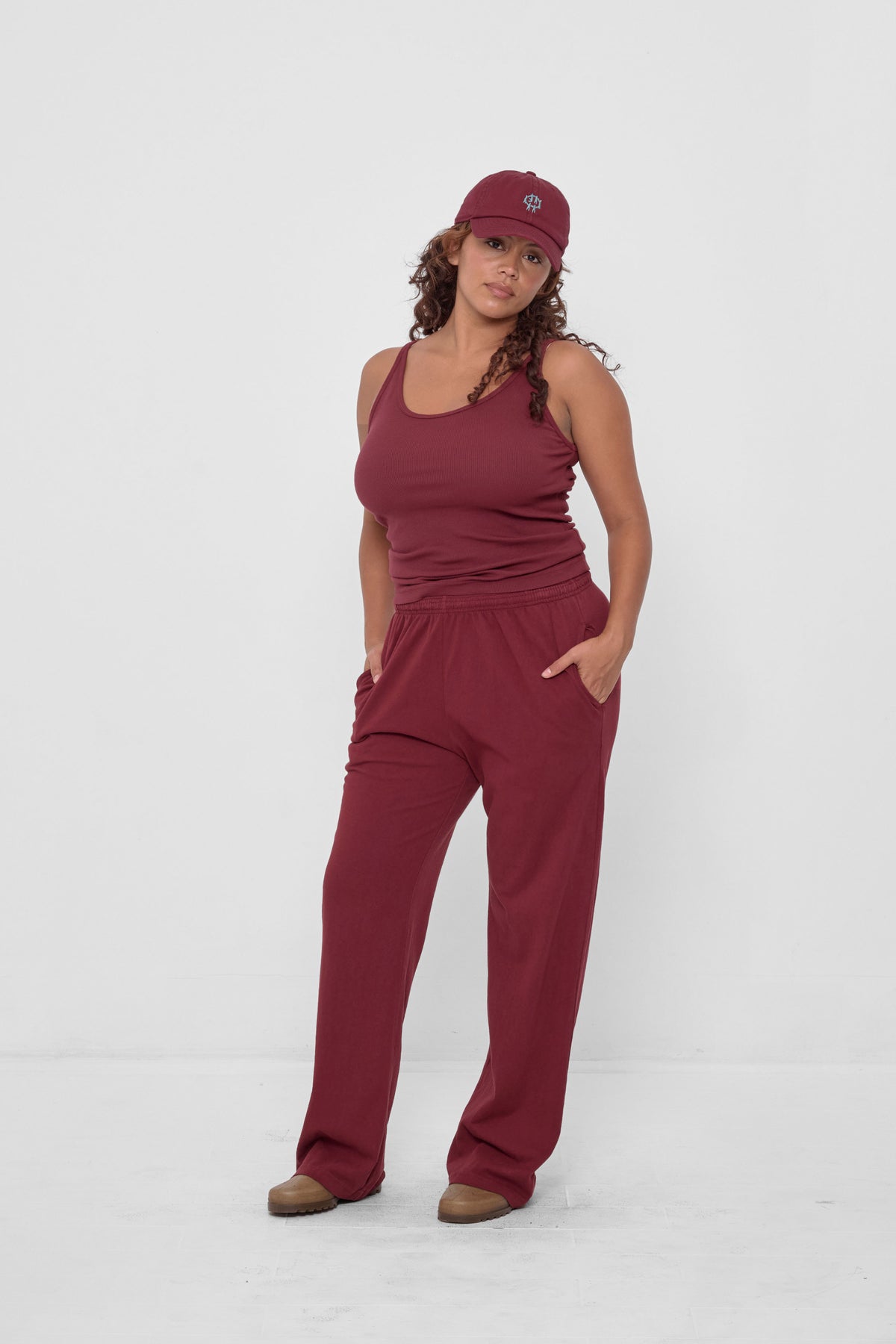 Apartment Pants in Garnet – styled with matching Bucky Logo Cap and Rib Tank