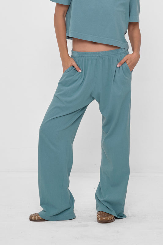 Apartment Pants in Oyster – front view, model's hands in each of 2 side pockets
