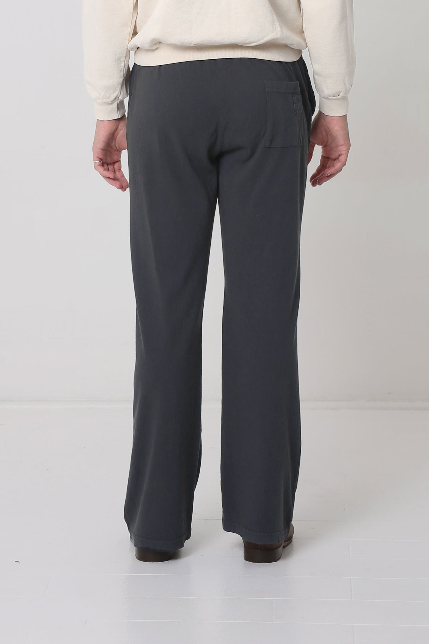 Back view shows patch pocket centered on right cheek.