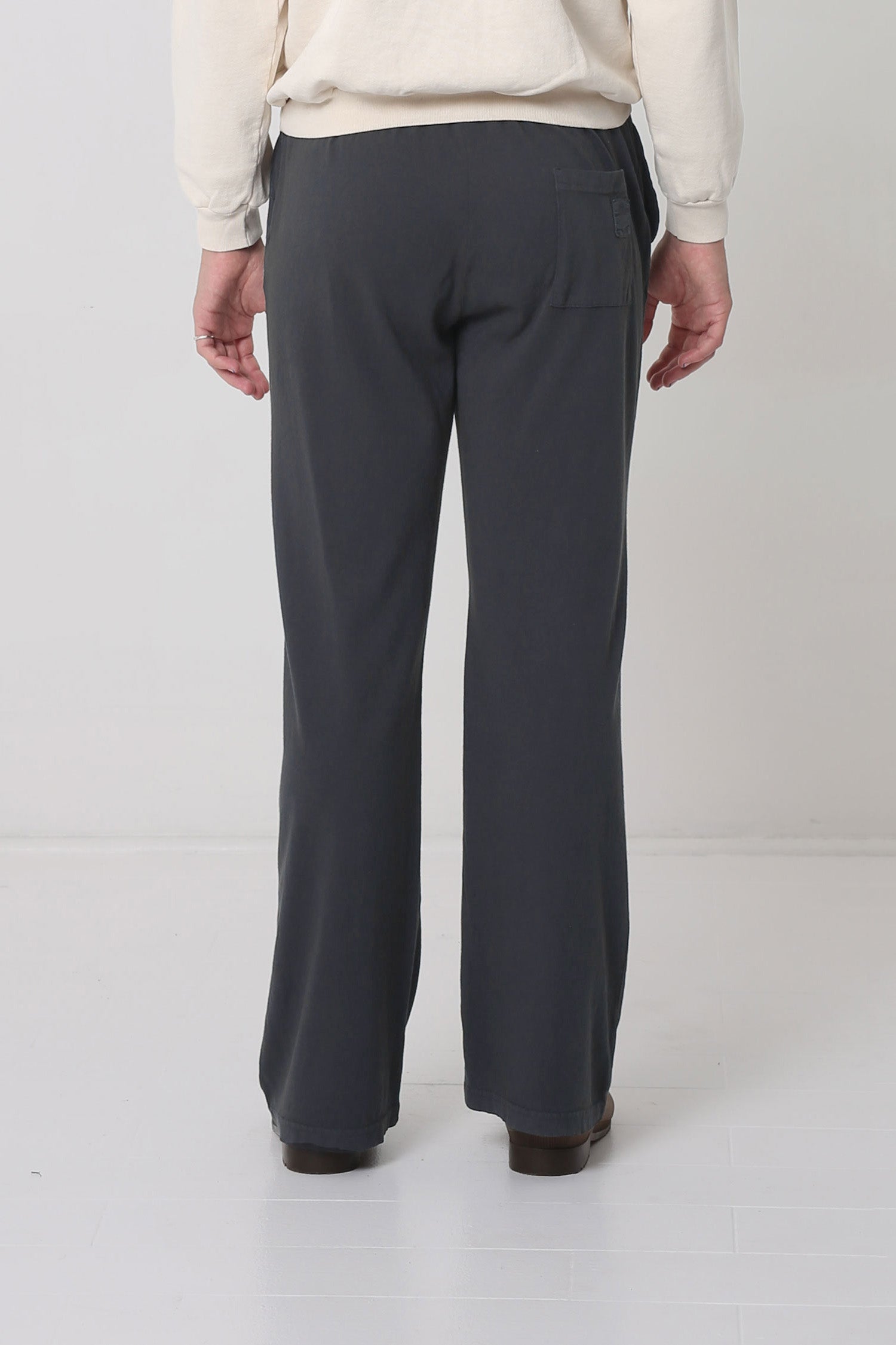 Back view shows patch pocket centered on right cheek.