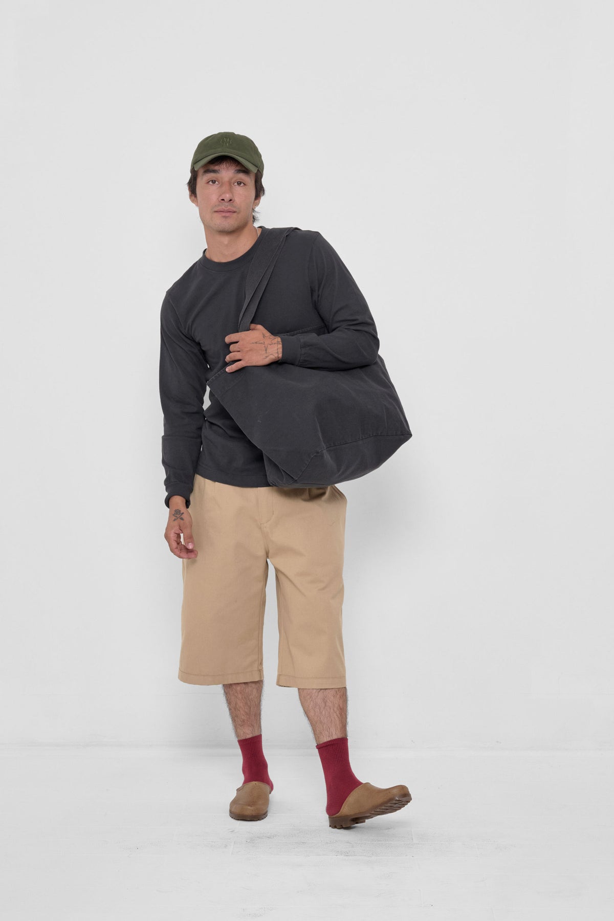 Big Tote in Slate – carried on model's shoulder, full-body view showing scale.