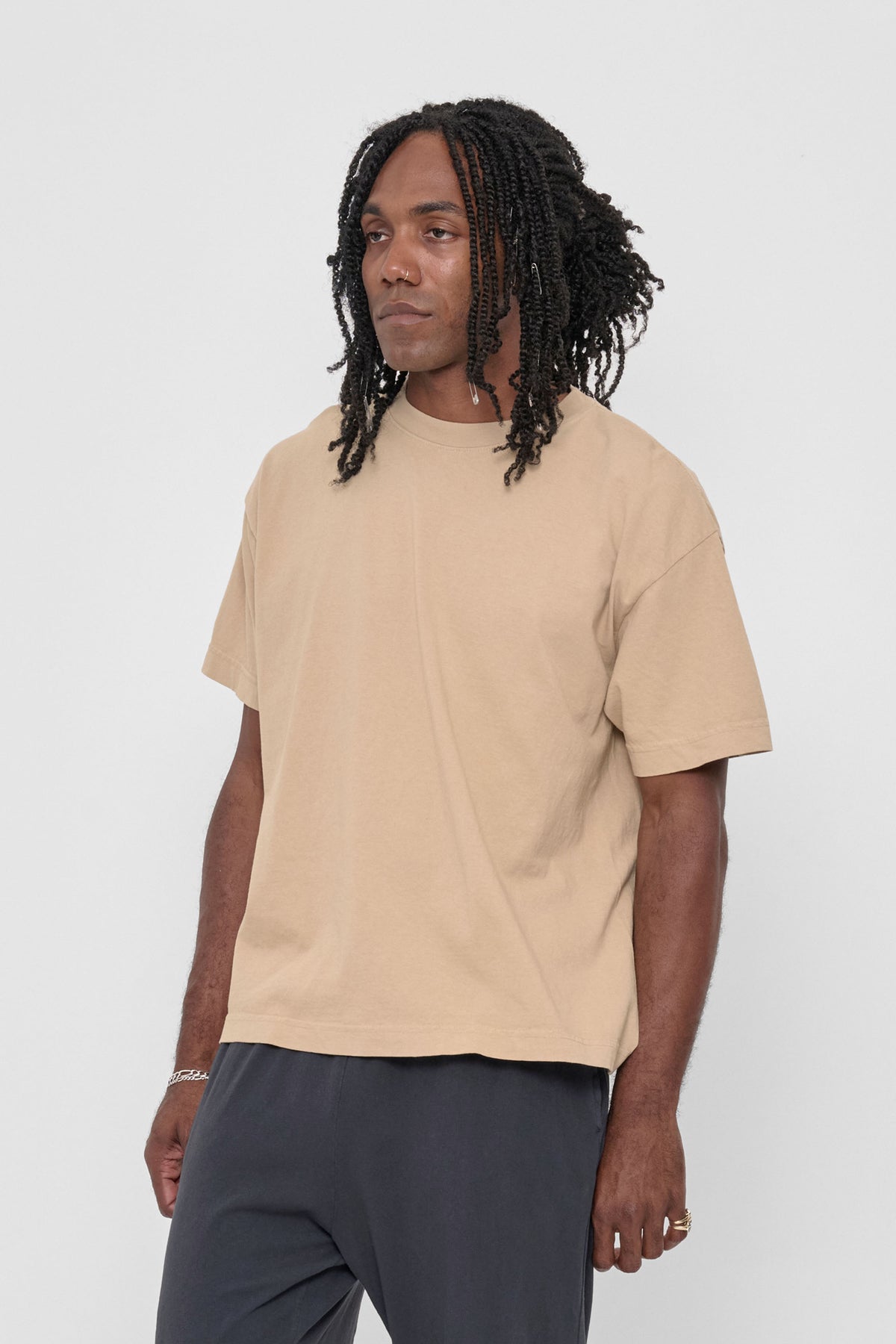 Boxier Trash Tee in Sand Storm – 3/4 front view on model