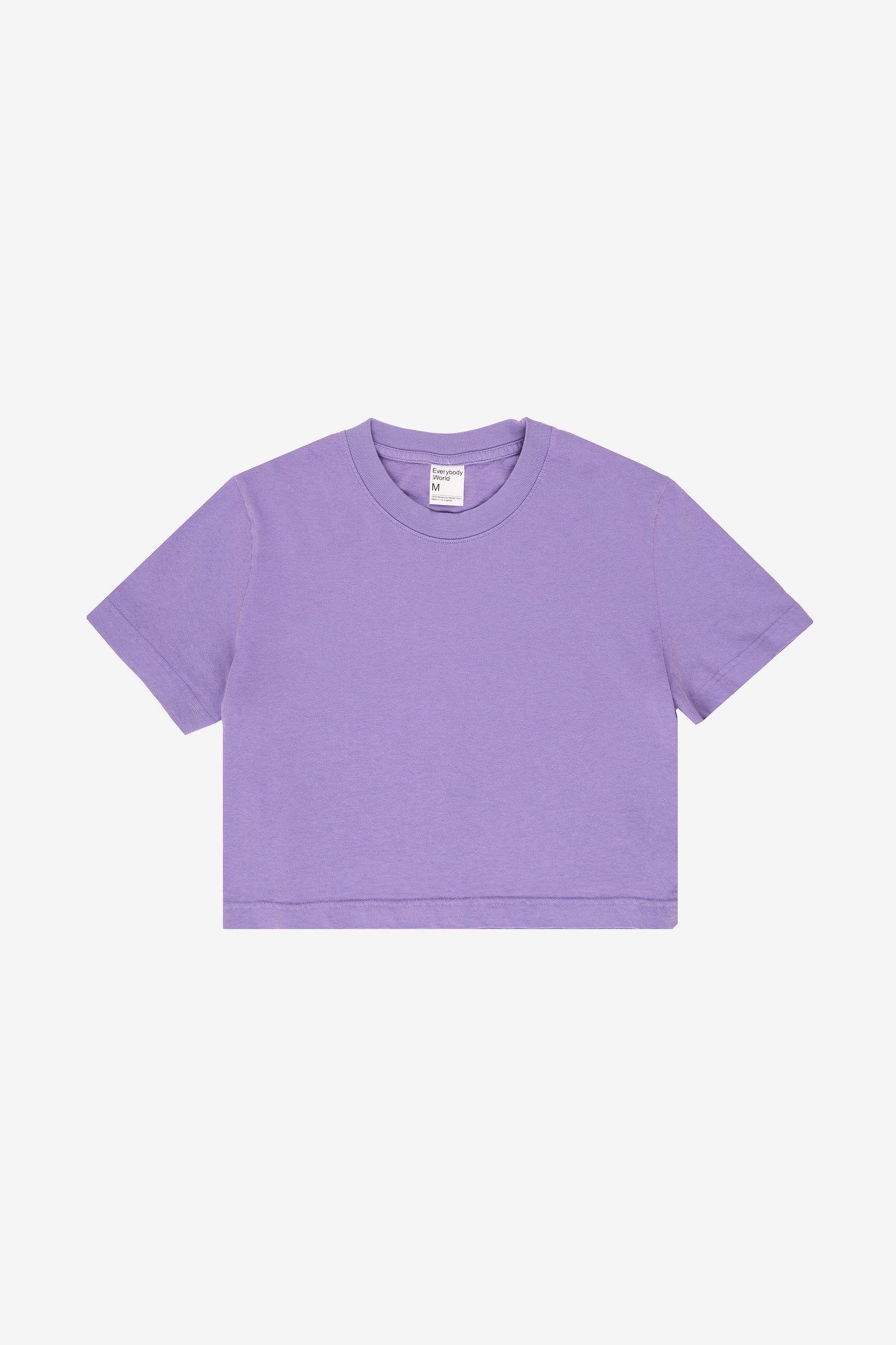 Flat lay showing t-shirt's cropped silhouette.