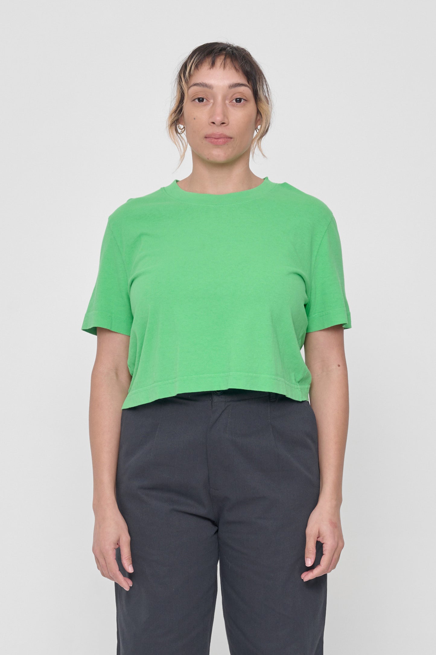 Front view of 5'4" woman wearing size L Nice Grass Baby Trash Tee. Hem hits at her navel. 