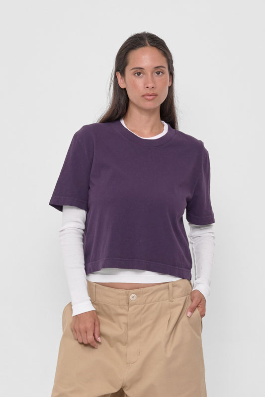 Baby Trash Tee in Washed Mulberry – front view layered over White Rib Long Sleeve, on model