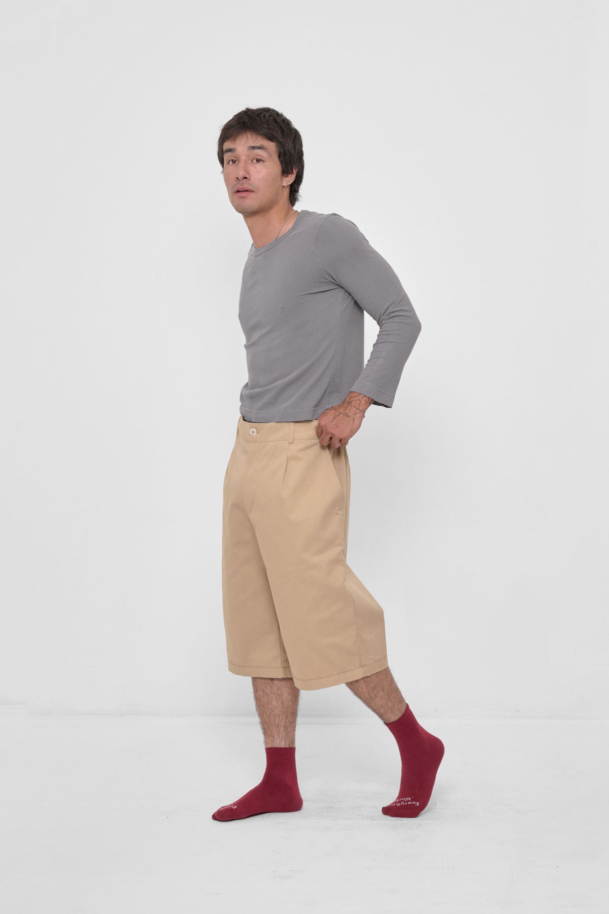Bermuda Shorts in Sand Storm – side view on model, styled with Stone Straight Sleeve Tailored Trash Tee