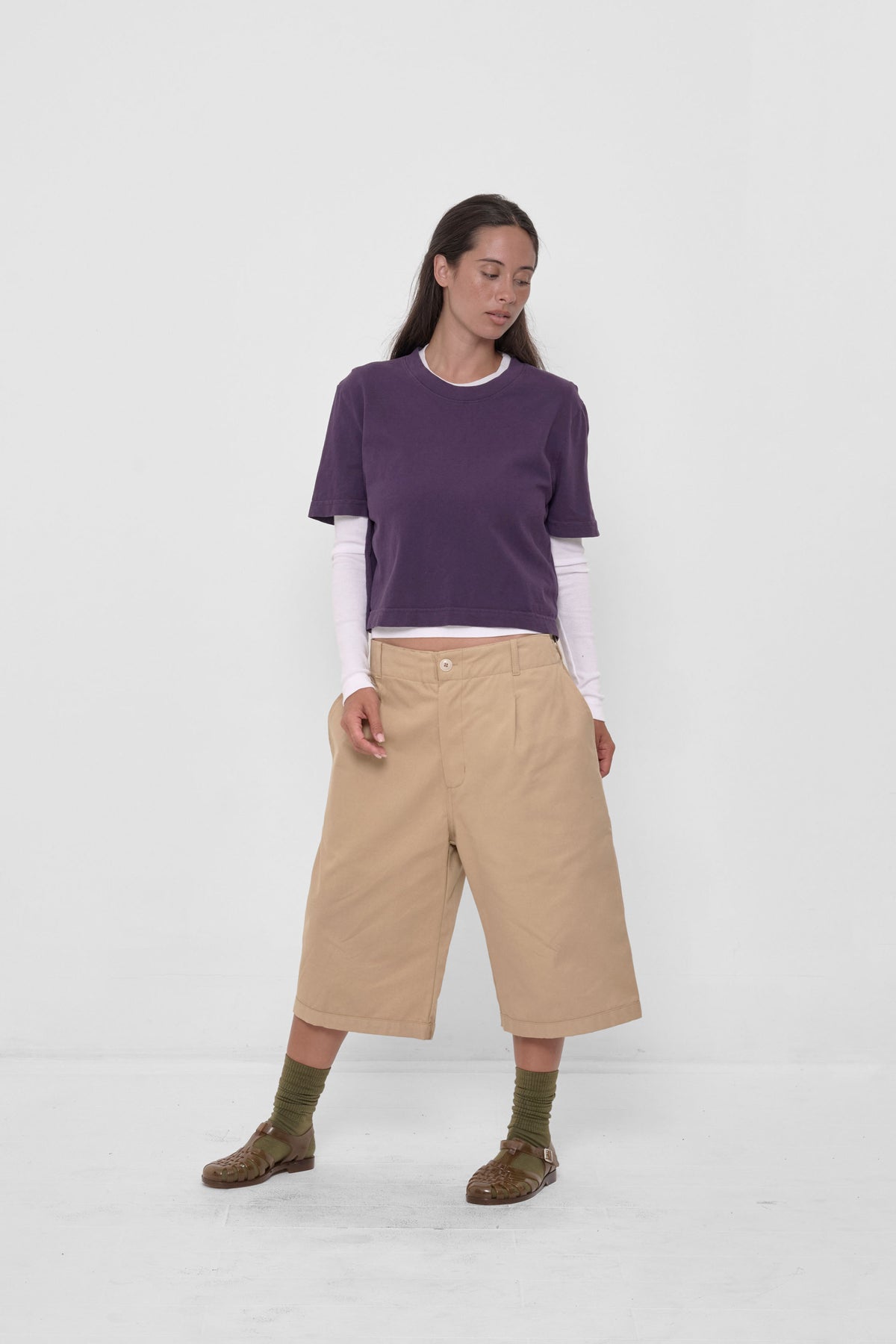 Bermuda Shorts in Sand Storm – styled with White Rib Long Sleeve, Washed Mulberry Baby Trash Tee, and Plasticana sandals
