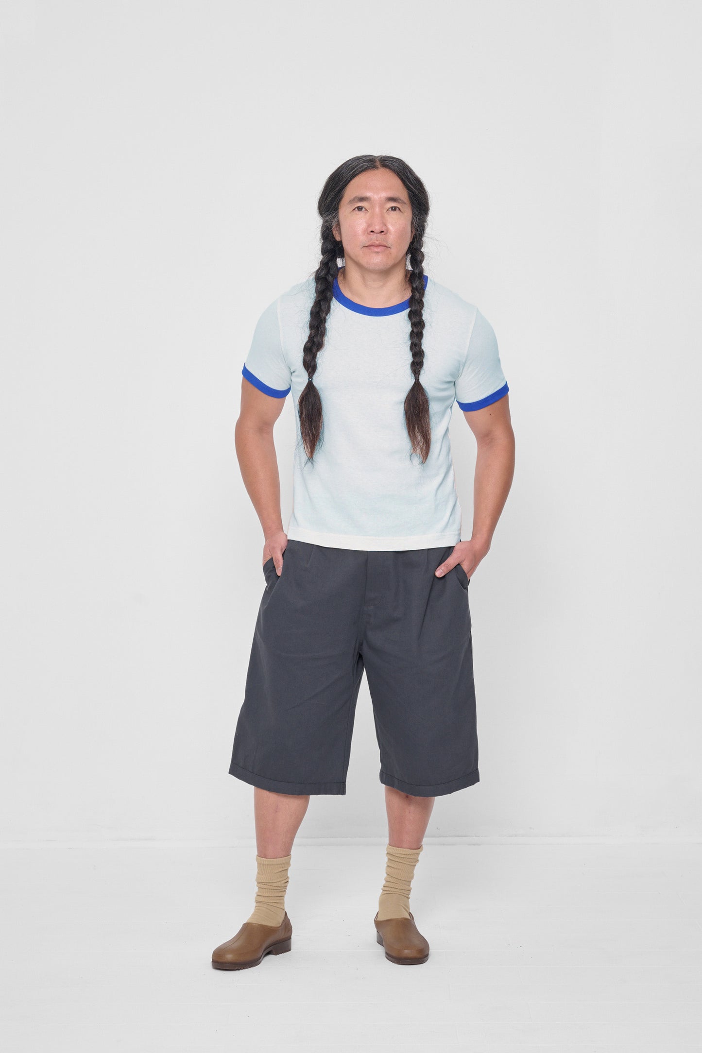 Hands in side pockets. Styled with Lapis Ringer Trash Tee and Plasticana Gardana Clogs.