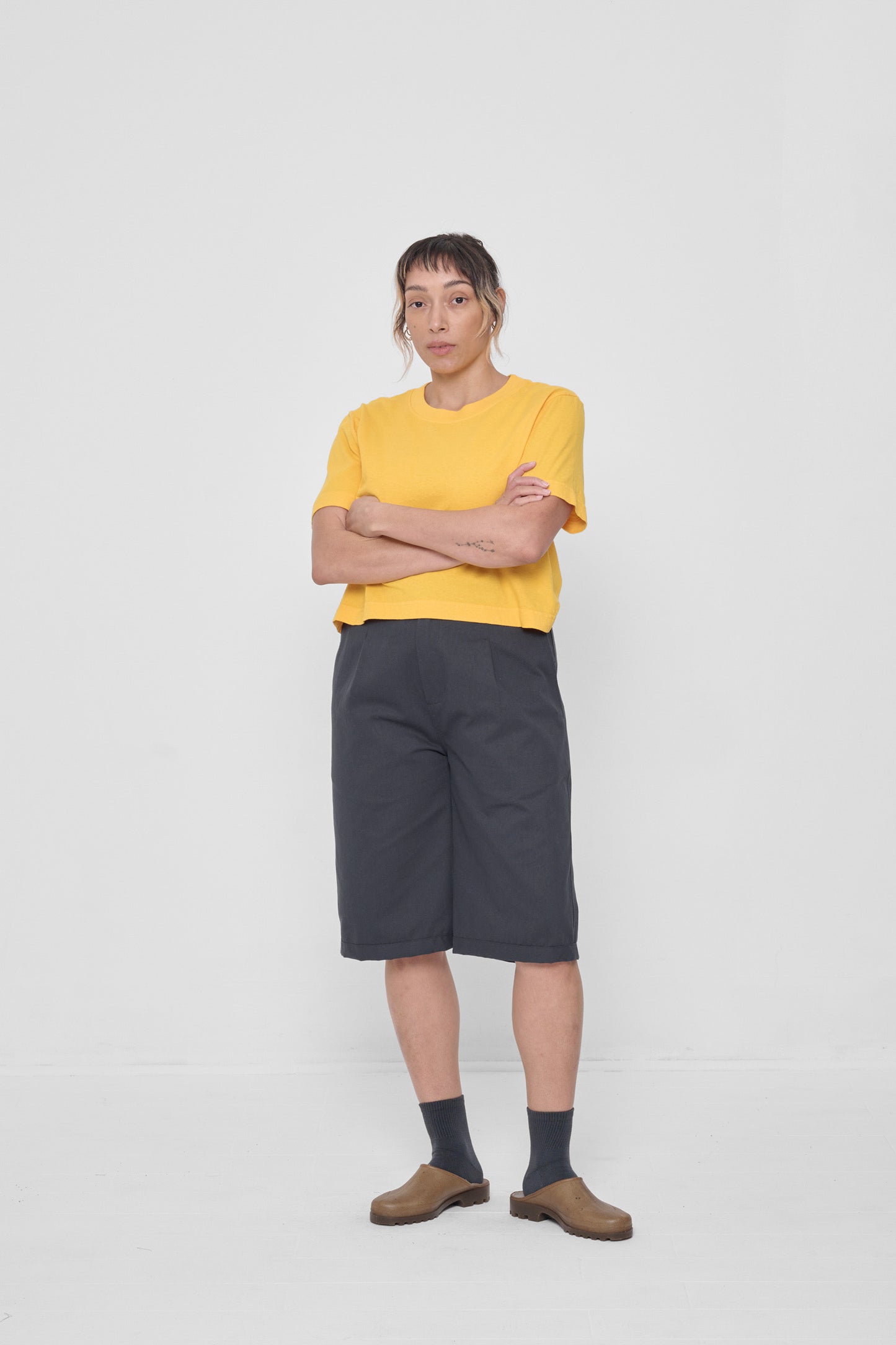 Styled with an Everybody Yellow Baby Trash Tee, Slate Spring Socks and Plasticana Opana Mules.