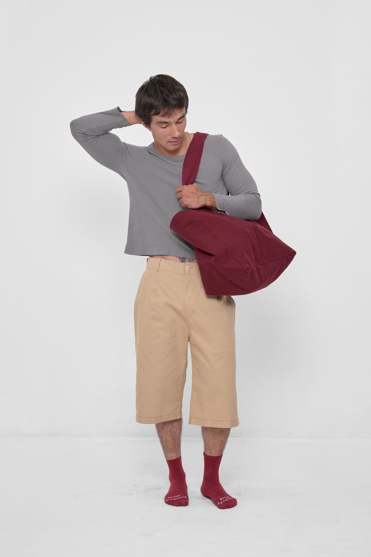 Big Tote in Garnet – carried on model's shoulder, full-body view showing scale.