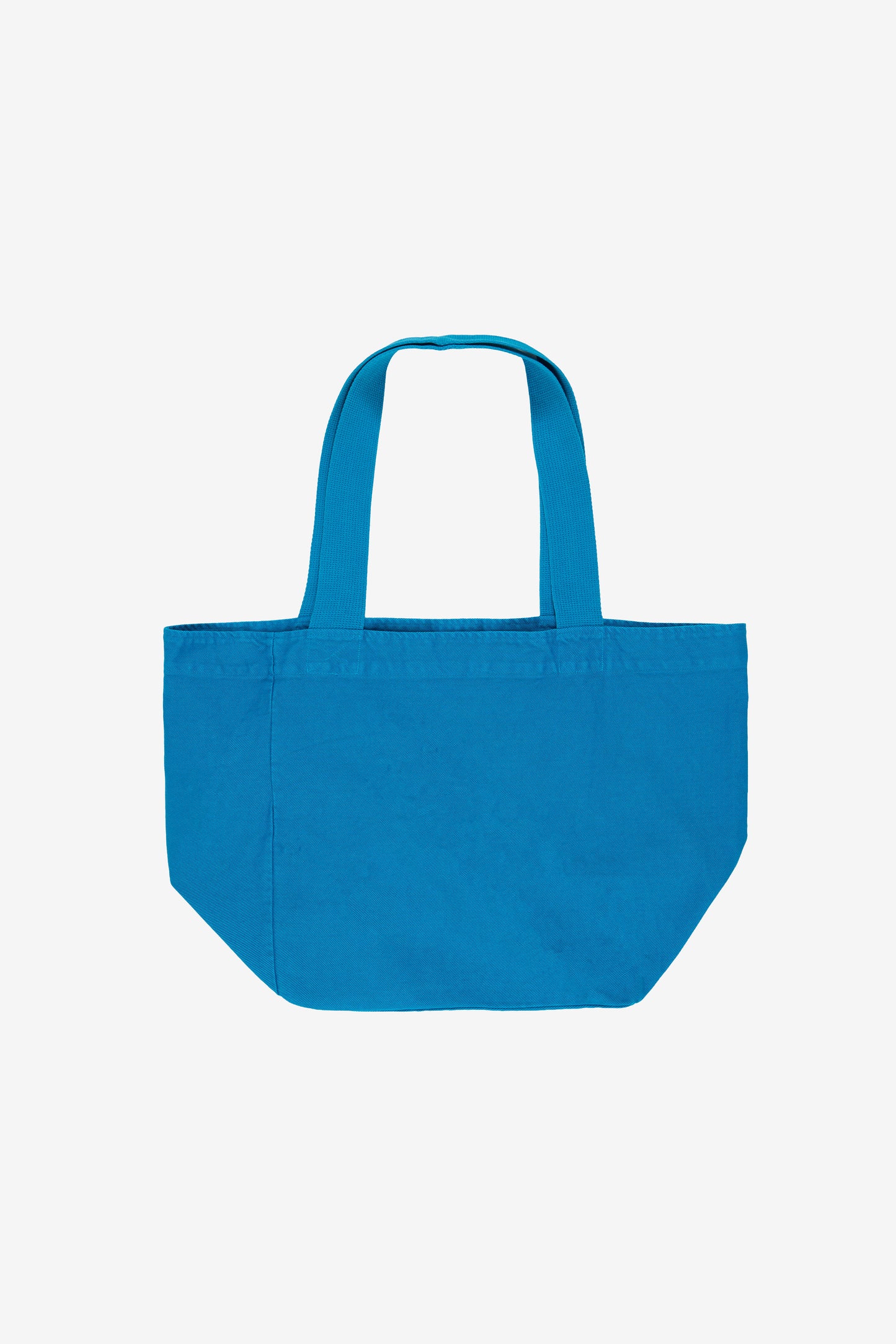 Flat lay showing depth, stitching, and web straps.