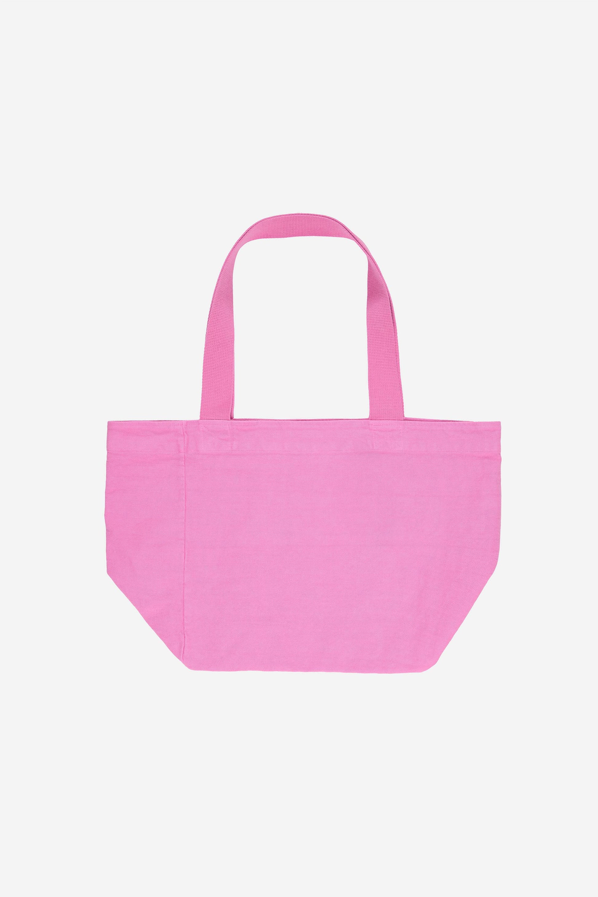 Flat lay of Big Tote in Pixie light pink, showing depth, stitching, and web straps.