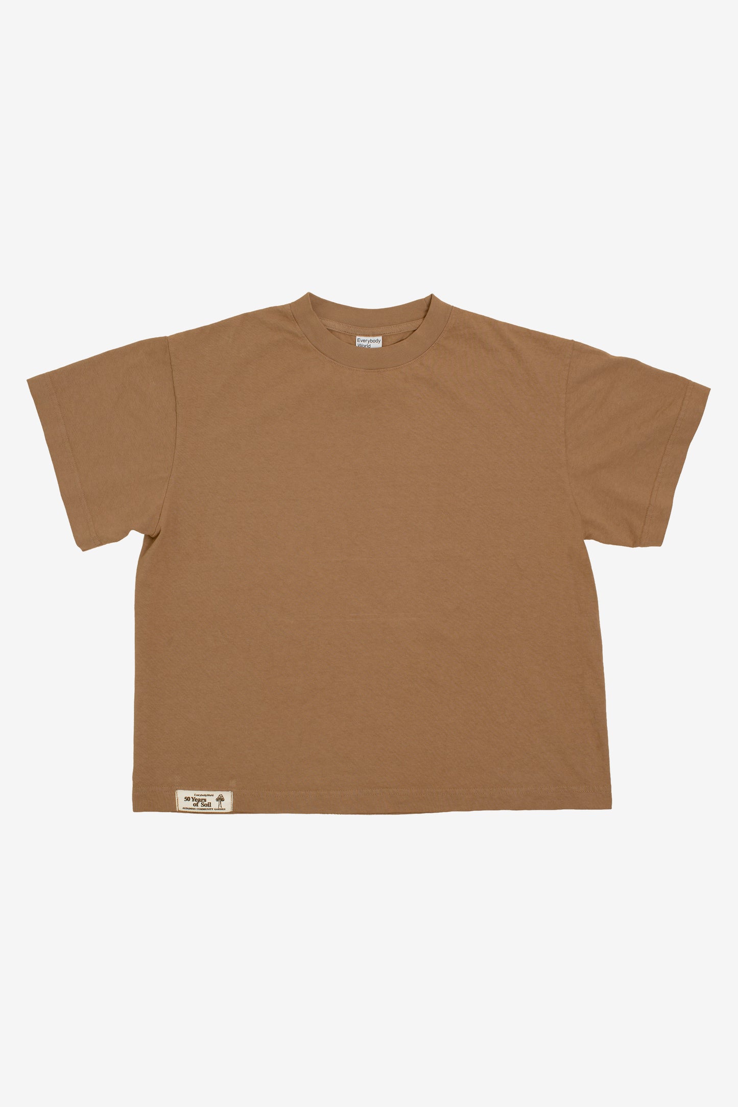 Flat lay showing the square-like boxy cut of the t-shirt.
