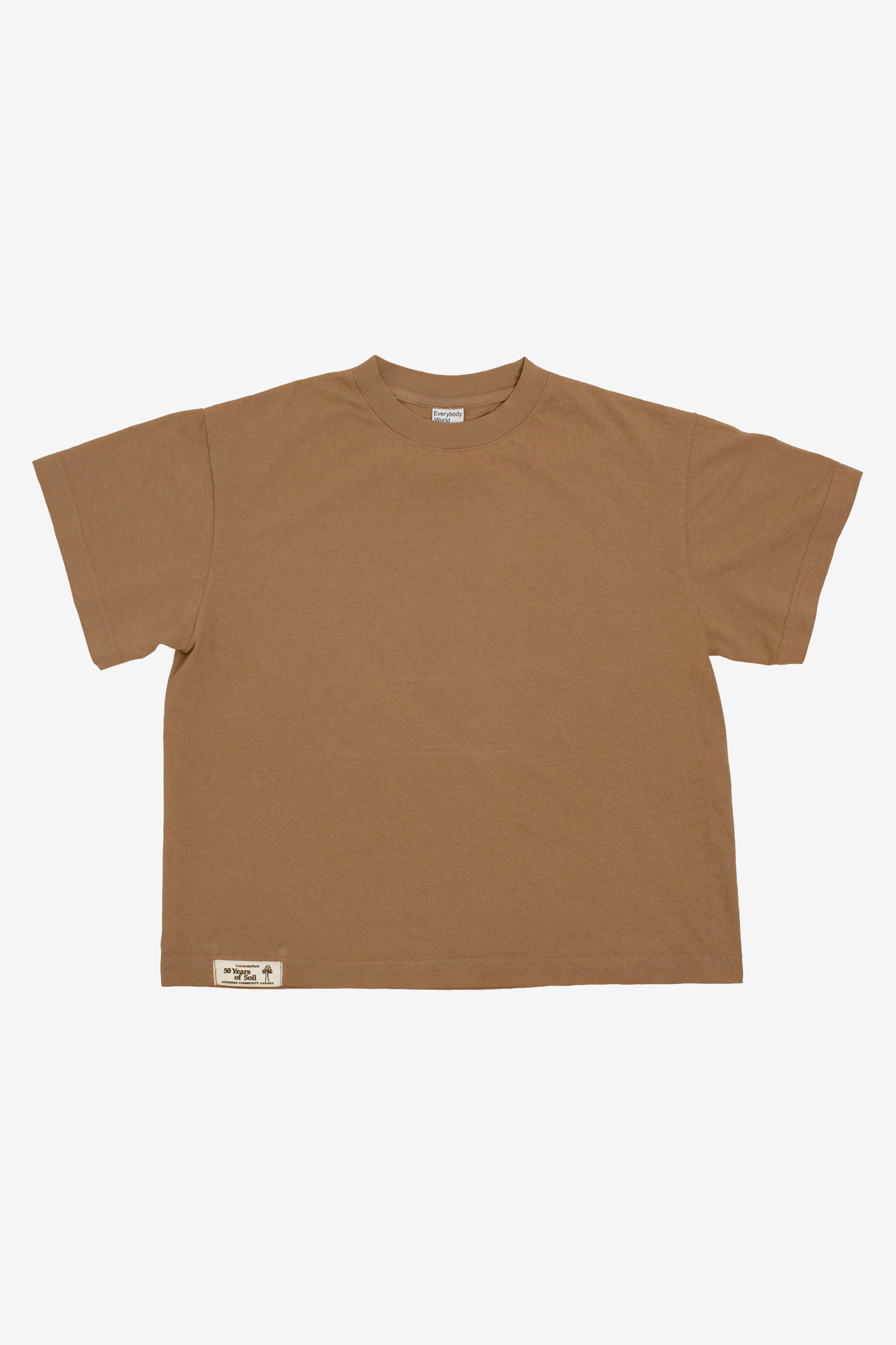 Flat lay showing the square-like boxy cut of the t-shirt.