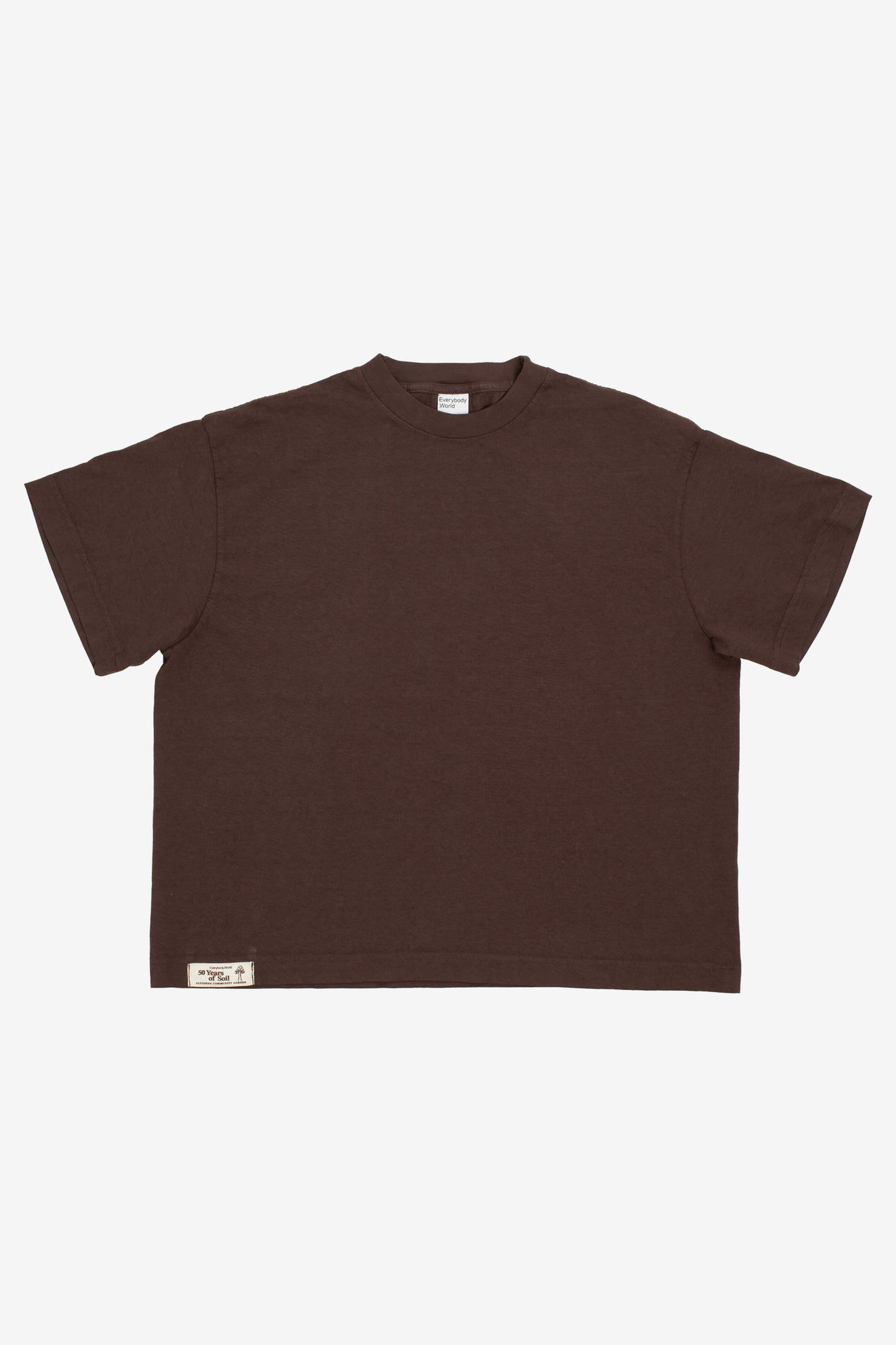 Flat lay showing the square-like boxy cut of the t-shirt.