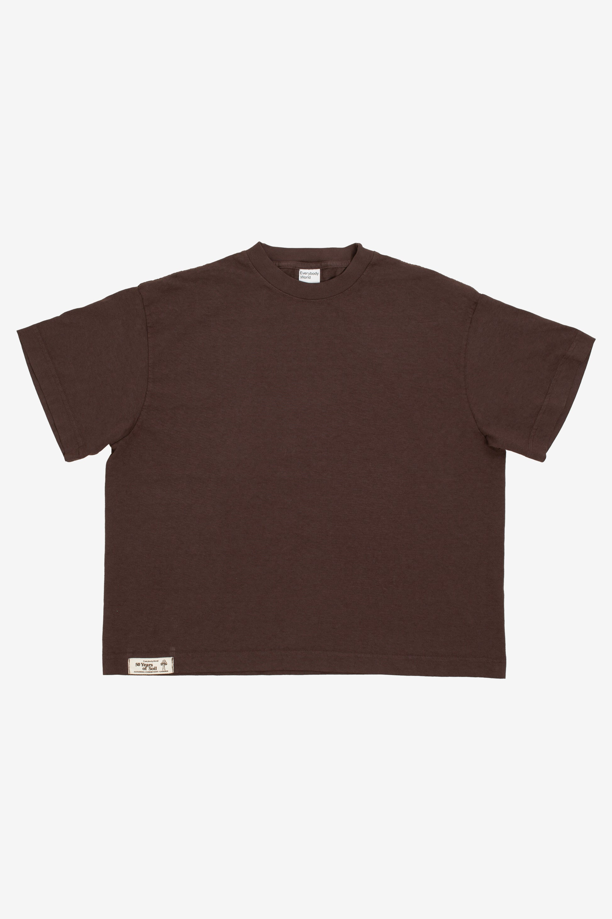 Flat lay showing the square-like boxy cut of the t-shirt.