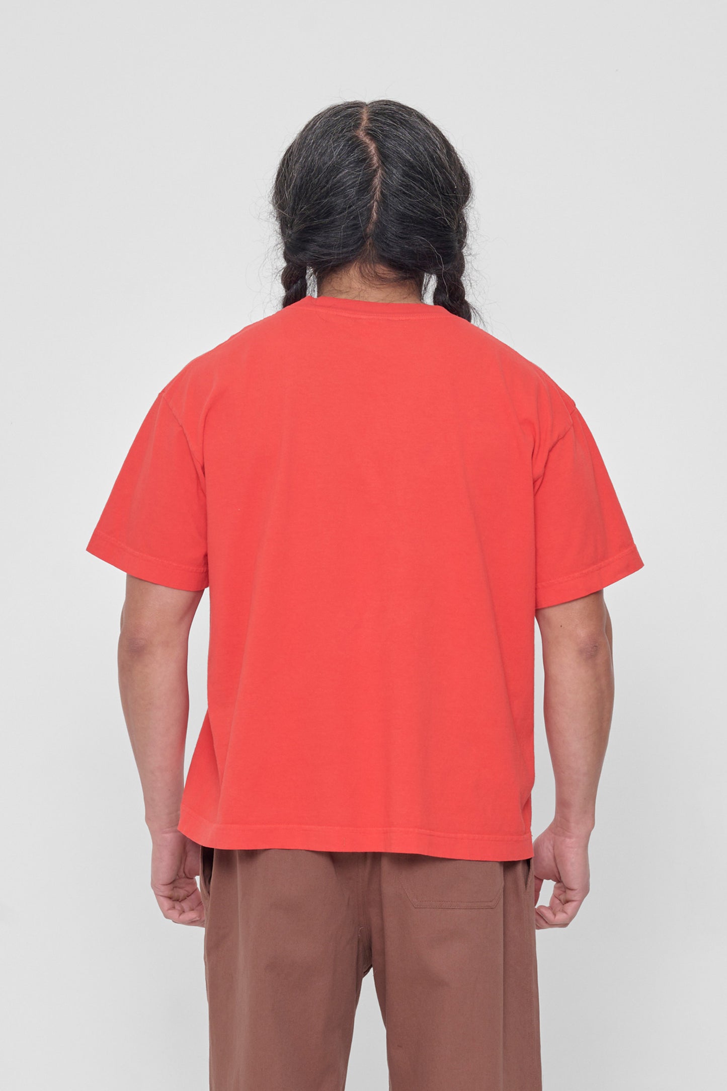 Back view showing fabric drape and relaxed fit throughout.