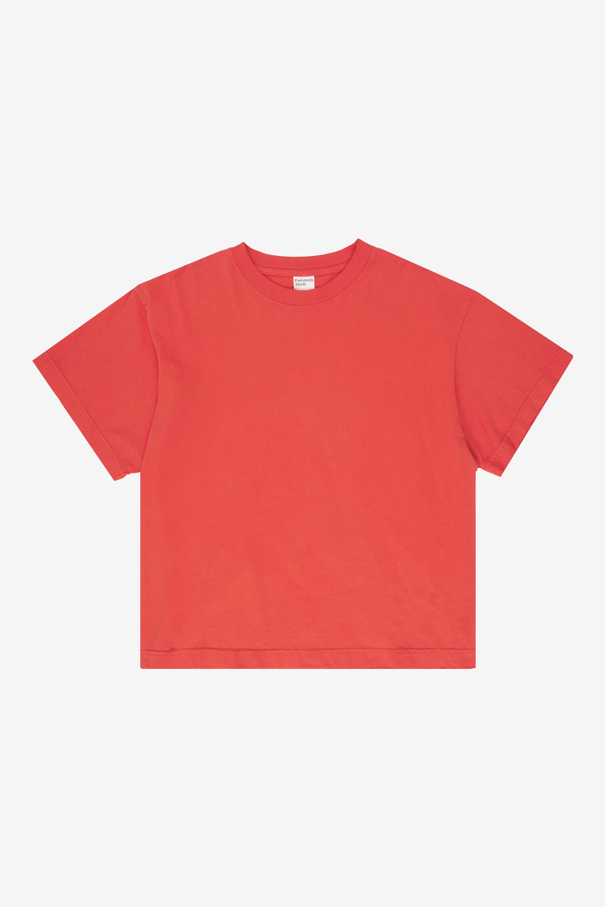 Flat lay showing the square-like boxy cut of the t-shirt.