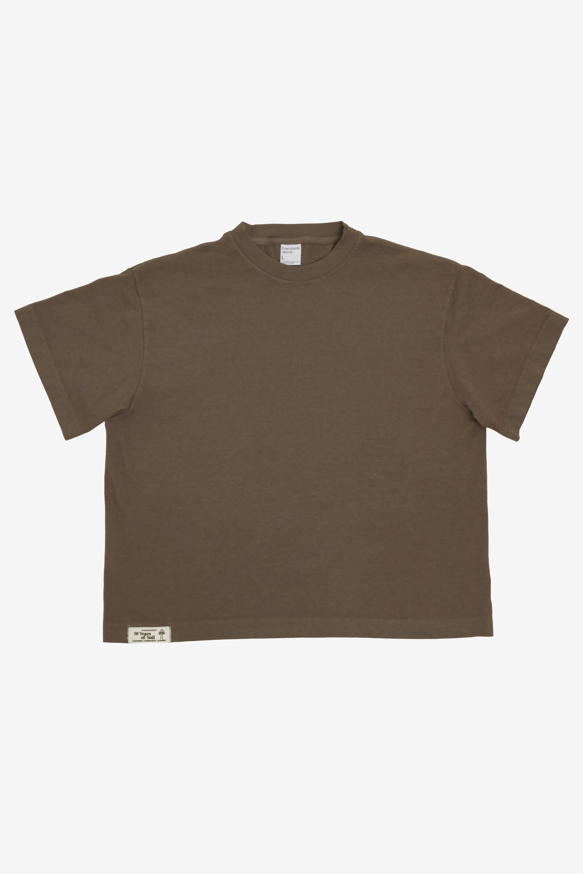 Flat lay showing the square-like boxy cut of the t-shirt.