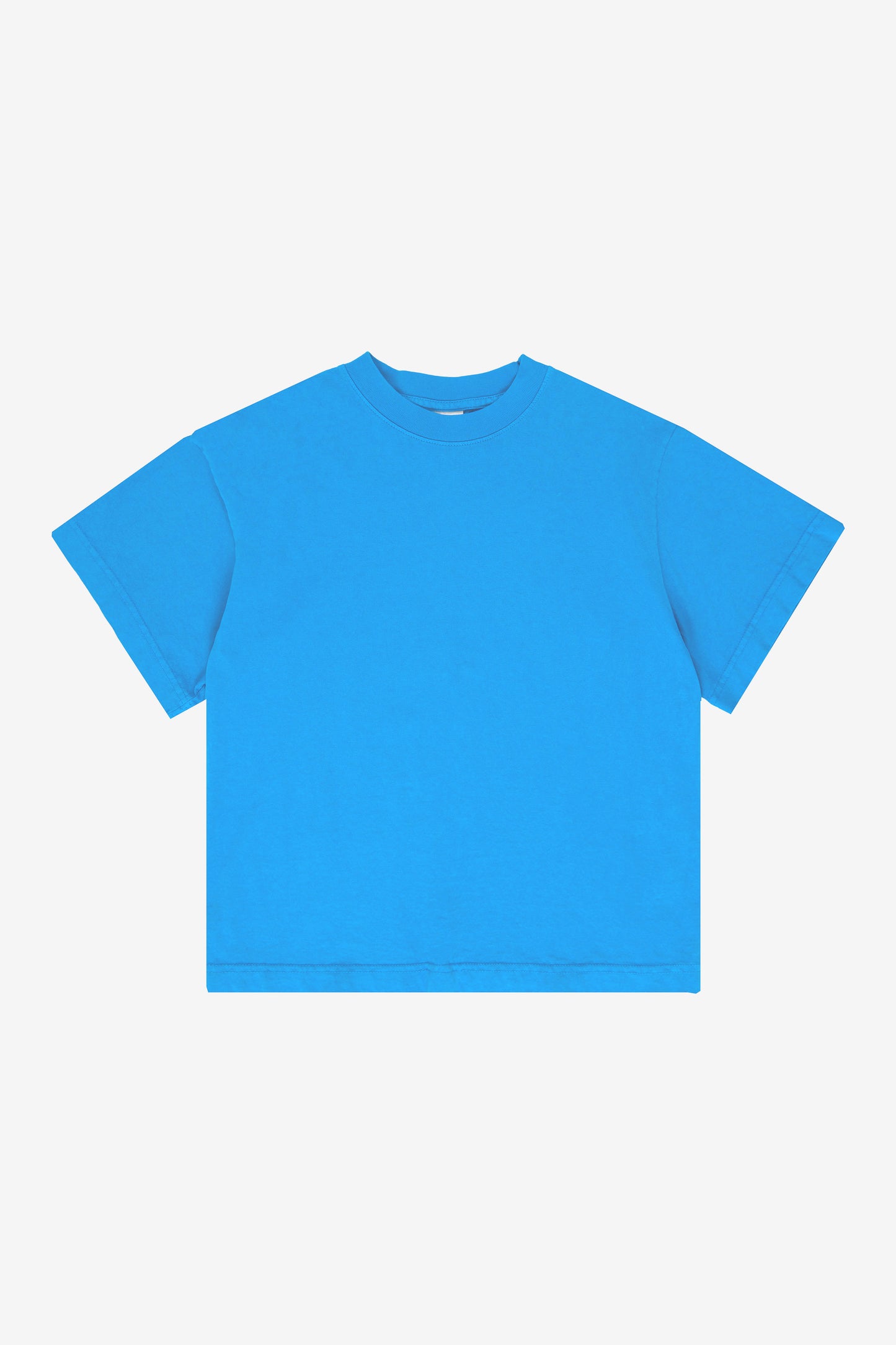 Flat lay showing the square-like boxy cut of the t-shirt.