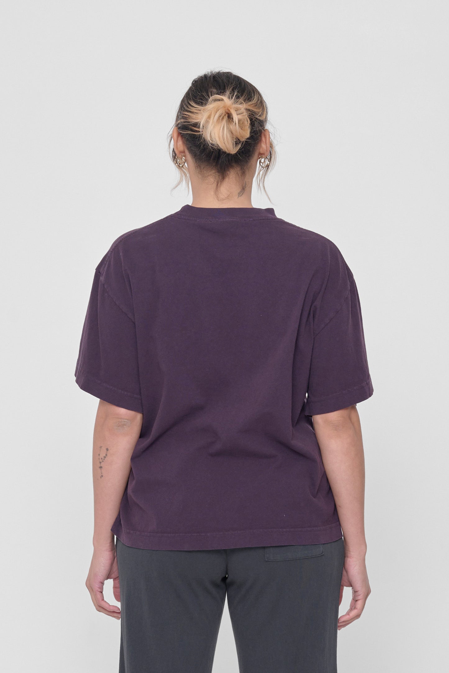 Back view showing fabric drape and relaxed fit throughout. 