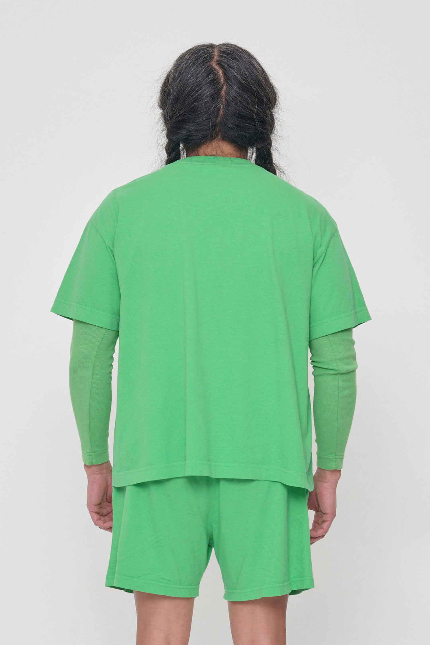 Back view showing fabric drape and relaxed fit throughout.