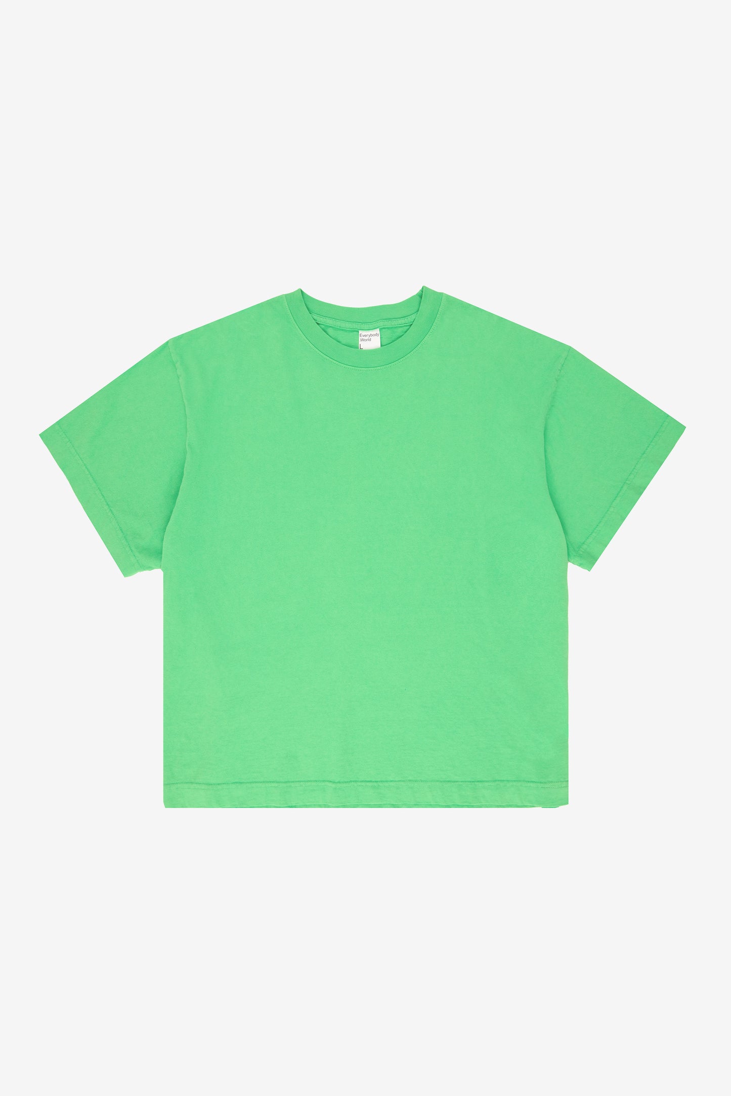 Flat lay showing the square-like boxy cut of the t-shirt.