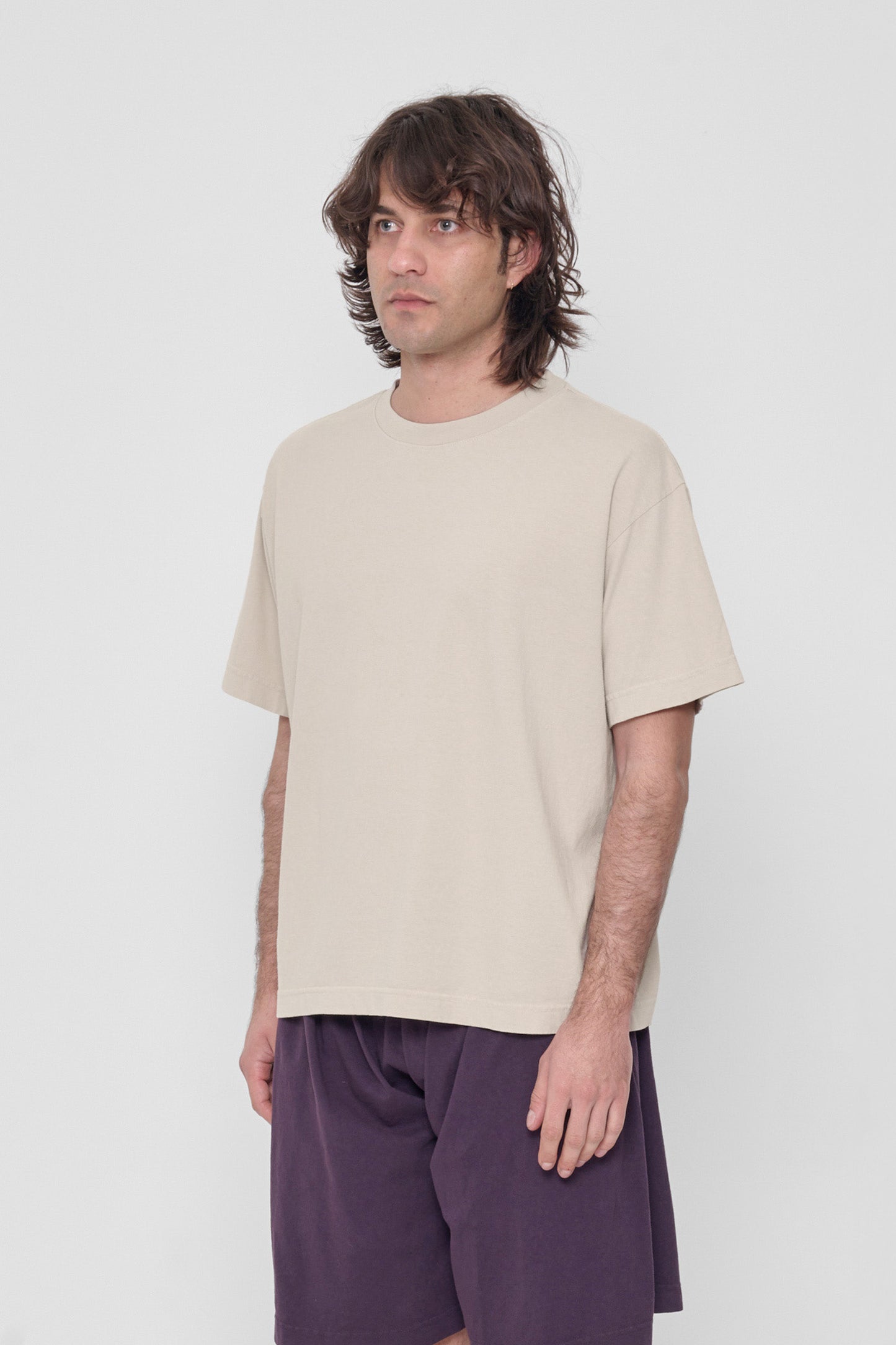 3/4 view showing lack of side seams and structured sleeve. 