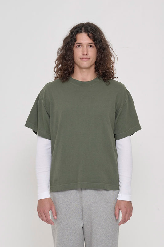 A 6' person wearing a Pine Boxier Trash Tee in size M. Hem at middle hip.