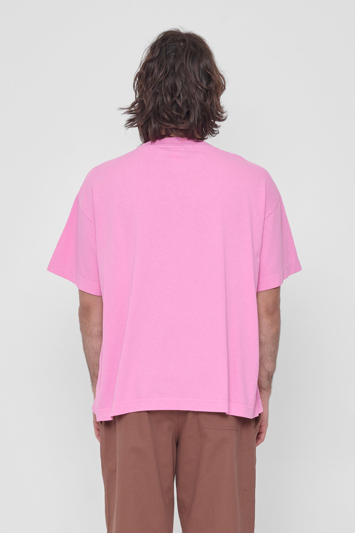 Back view showing fabric drape and relaxed fit throughout.