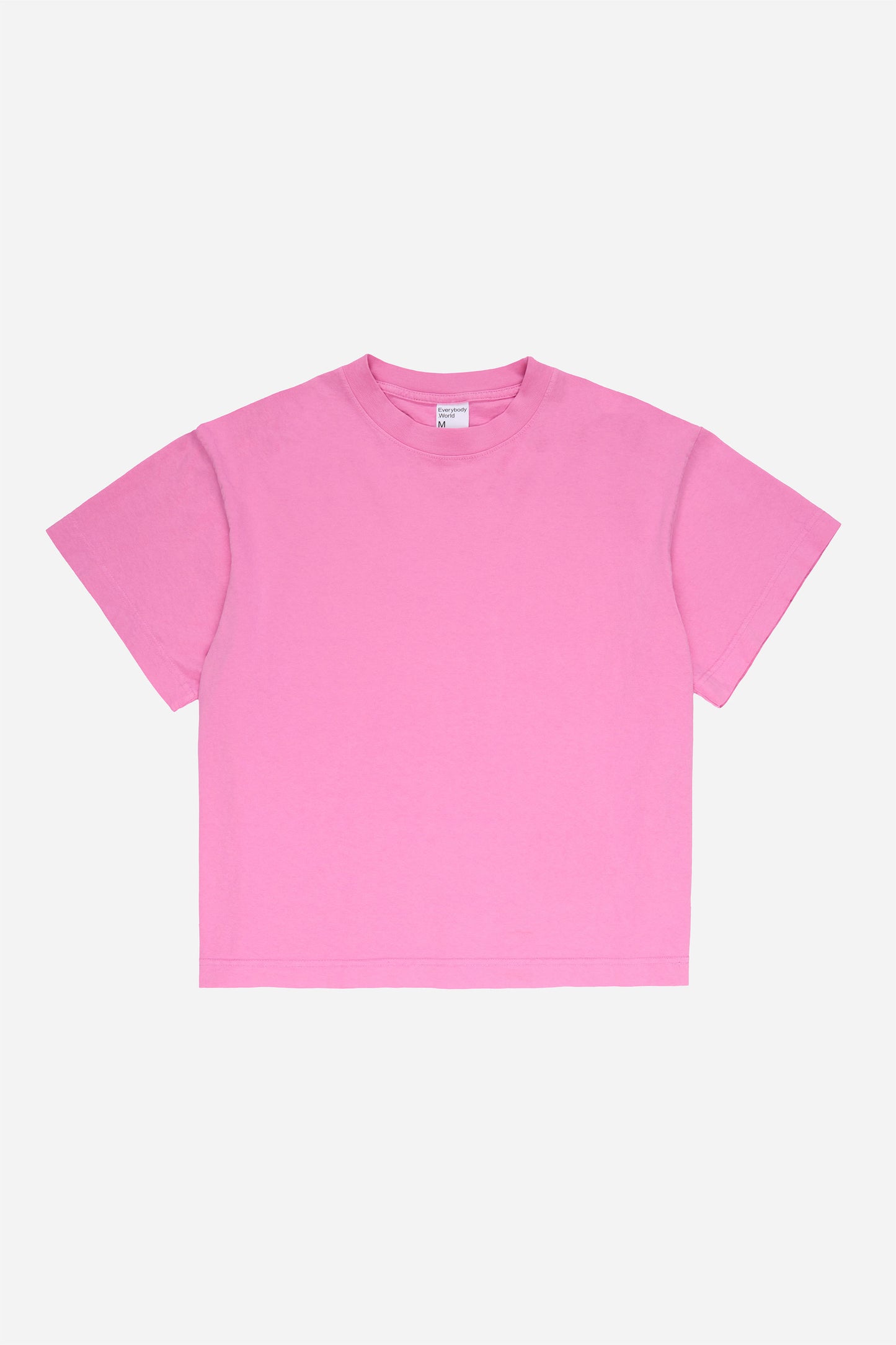 Flat lay of Pixie pink Boxier Trash Tee showing the cut of the t-shirt.