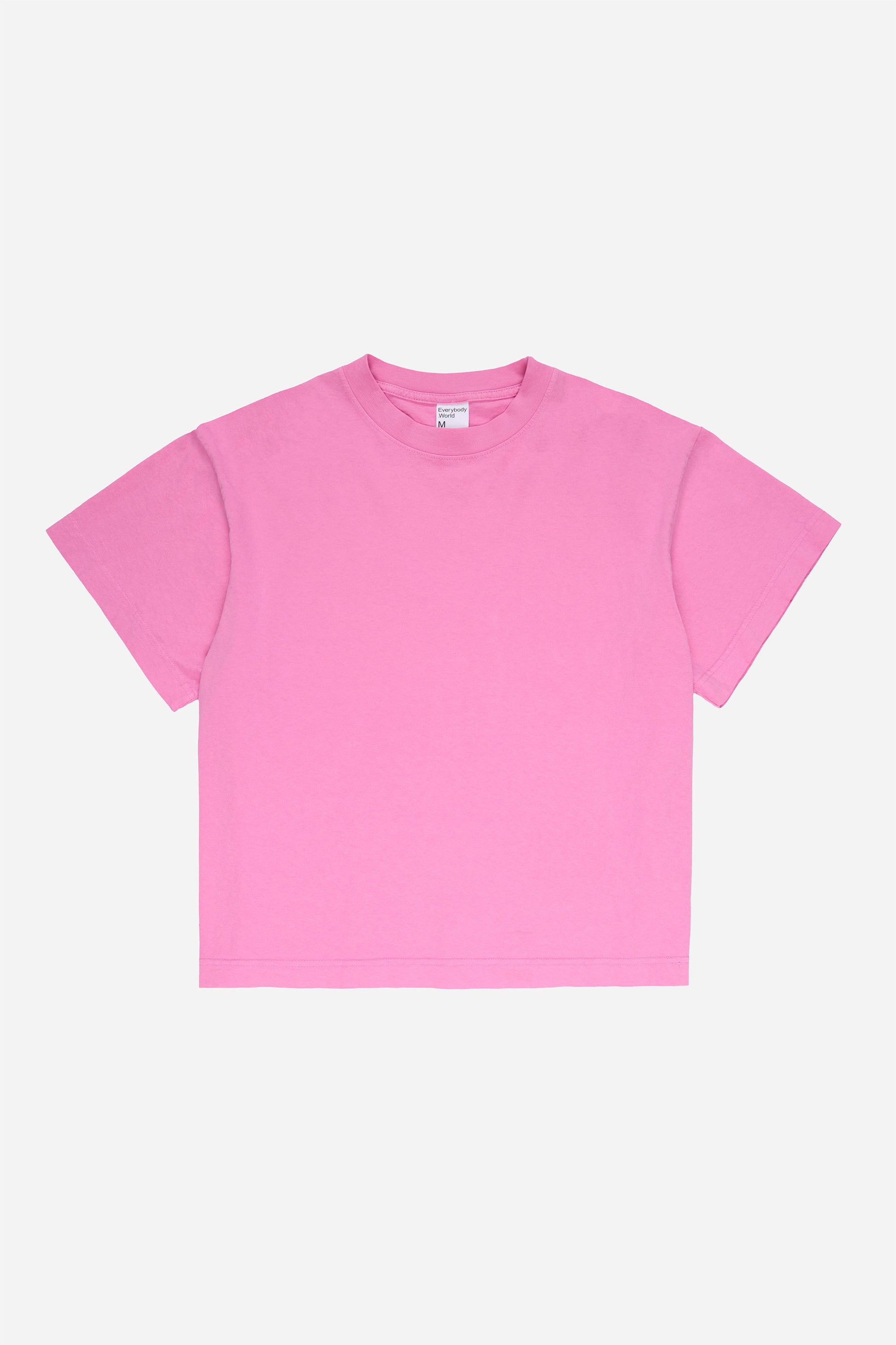 Flat lay of Pixie pink Boxier Trash Tee showing the cut of the t-shirt.
