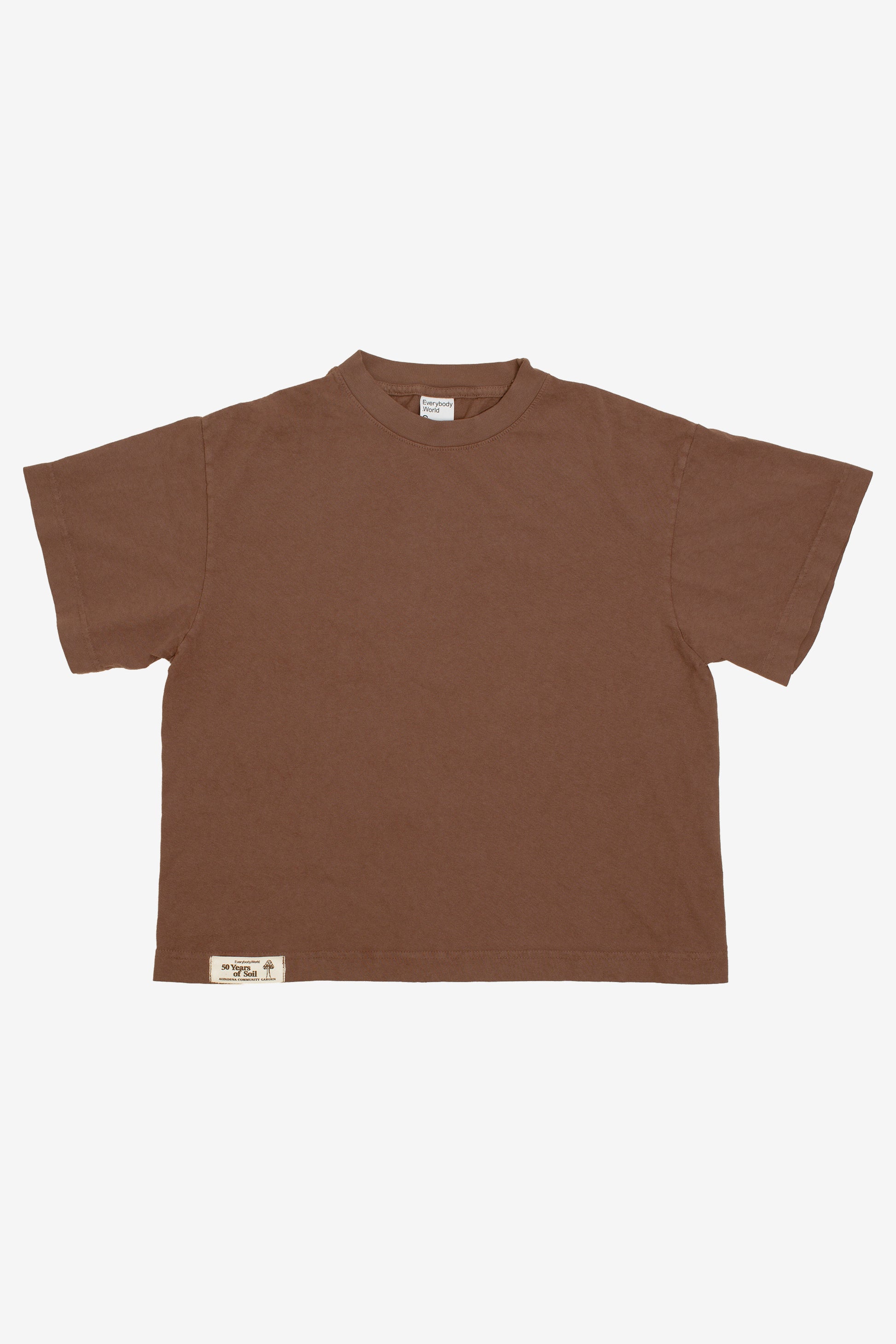 Flat lay showing the square-like boxy cut of the t-shirt.