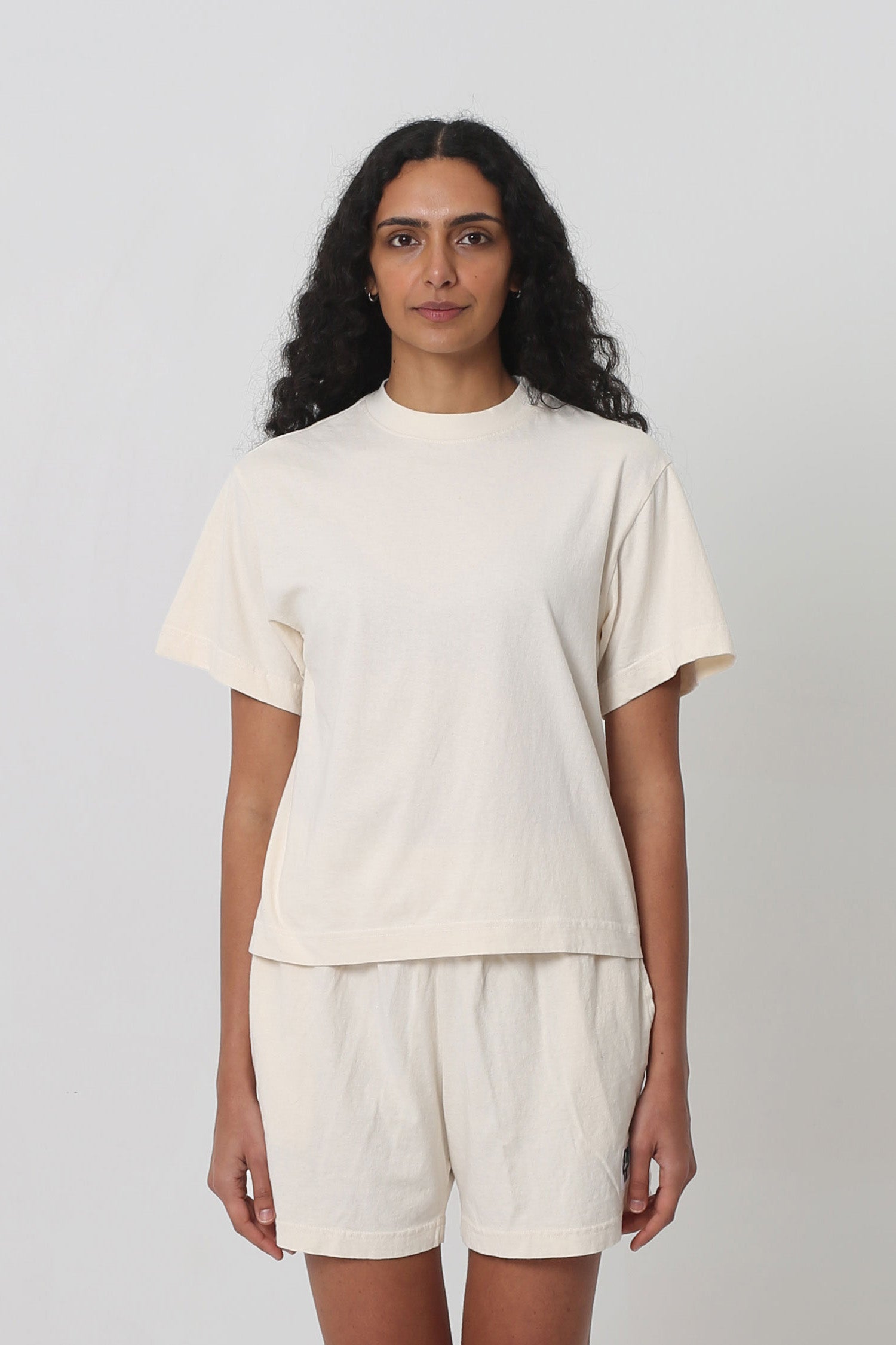 5'10" woman in XS Scour Boxier Trash Tee. Bottom hem ends at mid-hip.
