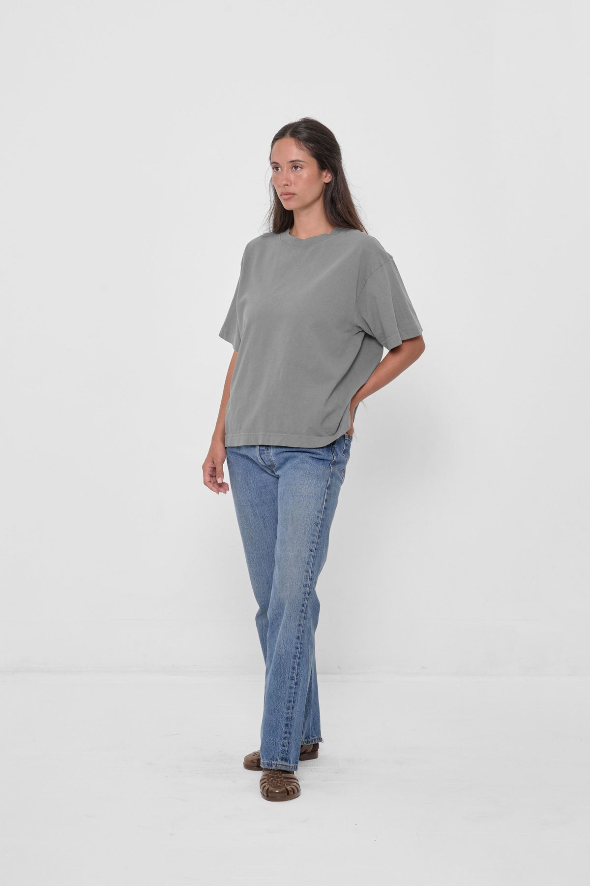 Boxier Trash Tee in Stone – front full body view, styled with jeans and Plasticana Jellies.