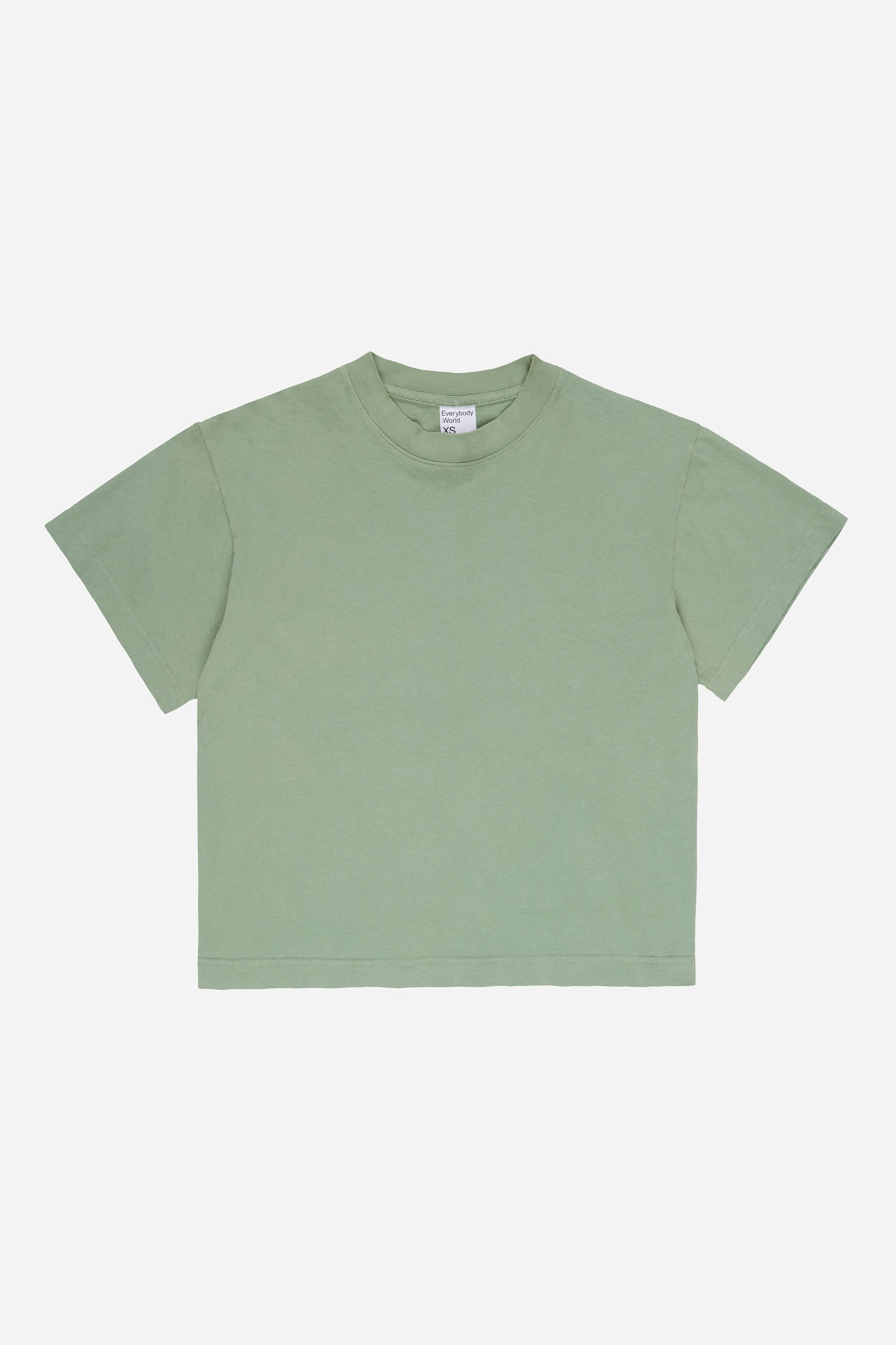 Flat lay of Wasabi light green Boxier Trash Tee showing the cut of the t-shirt.