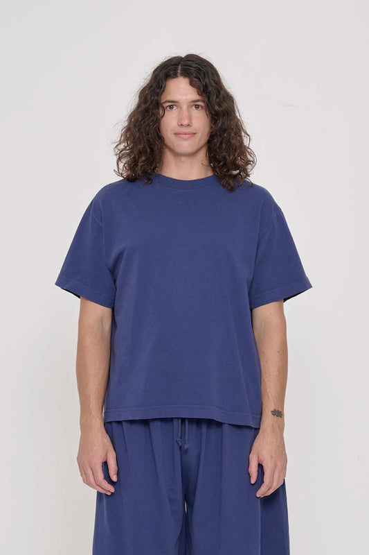 Front view of a 6' person wearing a Washed Navy Boxier Trash Tee in size M. Hem at lower-middle hip.