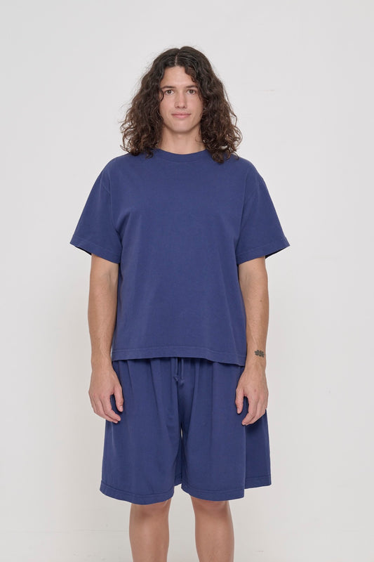 Front view of a 6' person wearing a Washed Navy Boxier Trash Tee in size M. Hem at lower-middle hip.