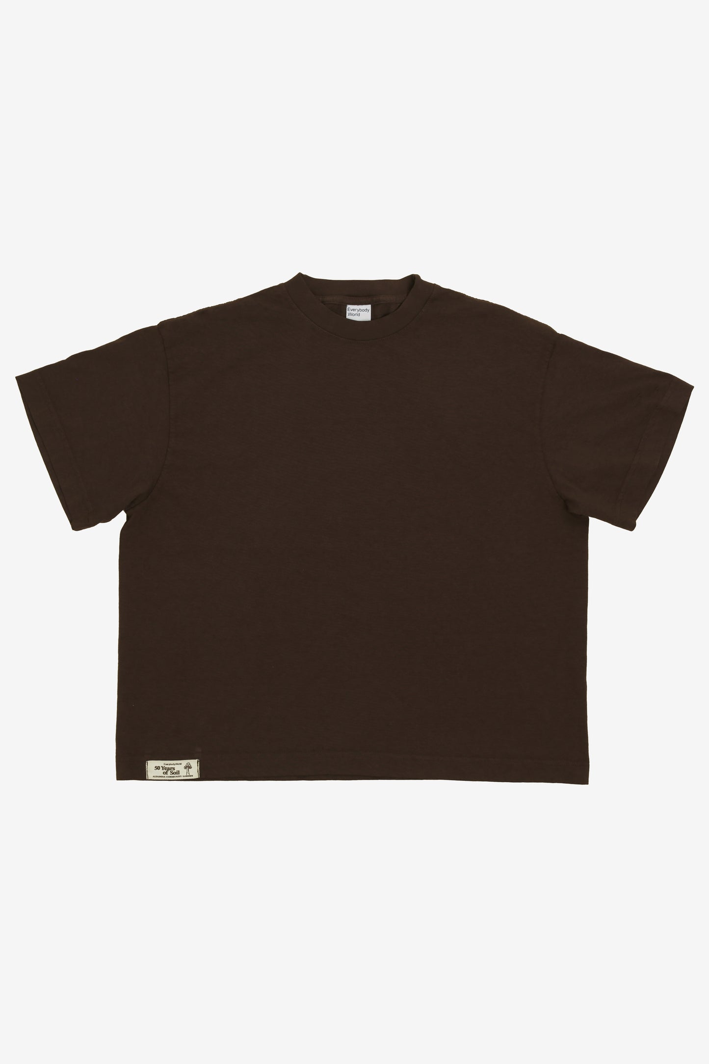 Flat lay showing the square-like boxy cut of the t-shirt.