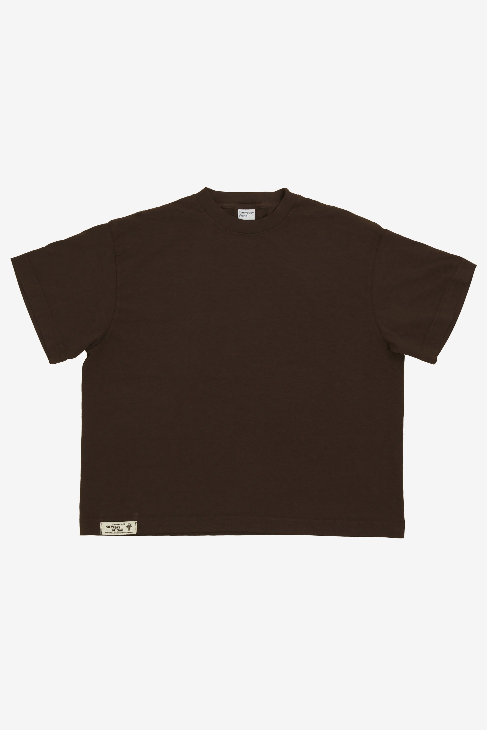 Flat lay showing the square-like boxy cut of the t-shirt.