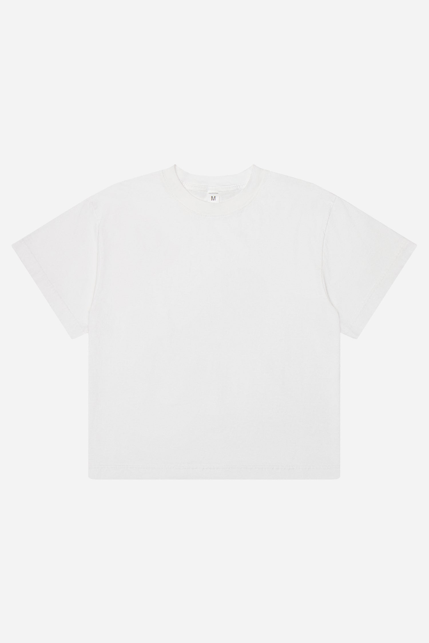 Flat lay of White Heavyweight Boxier Trash Tee showing the straight boxy cut of the T-shirt.
