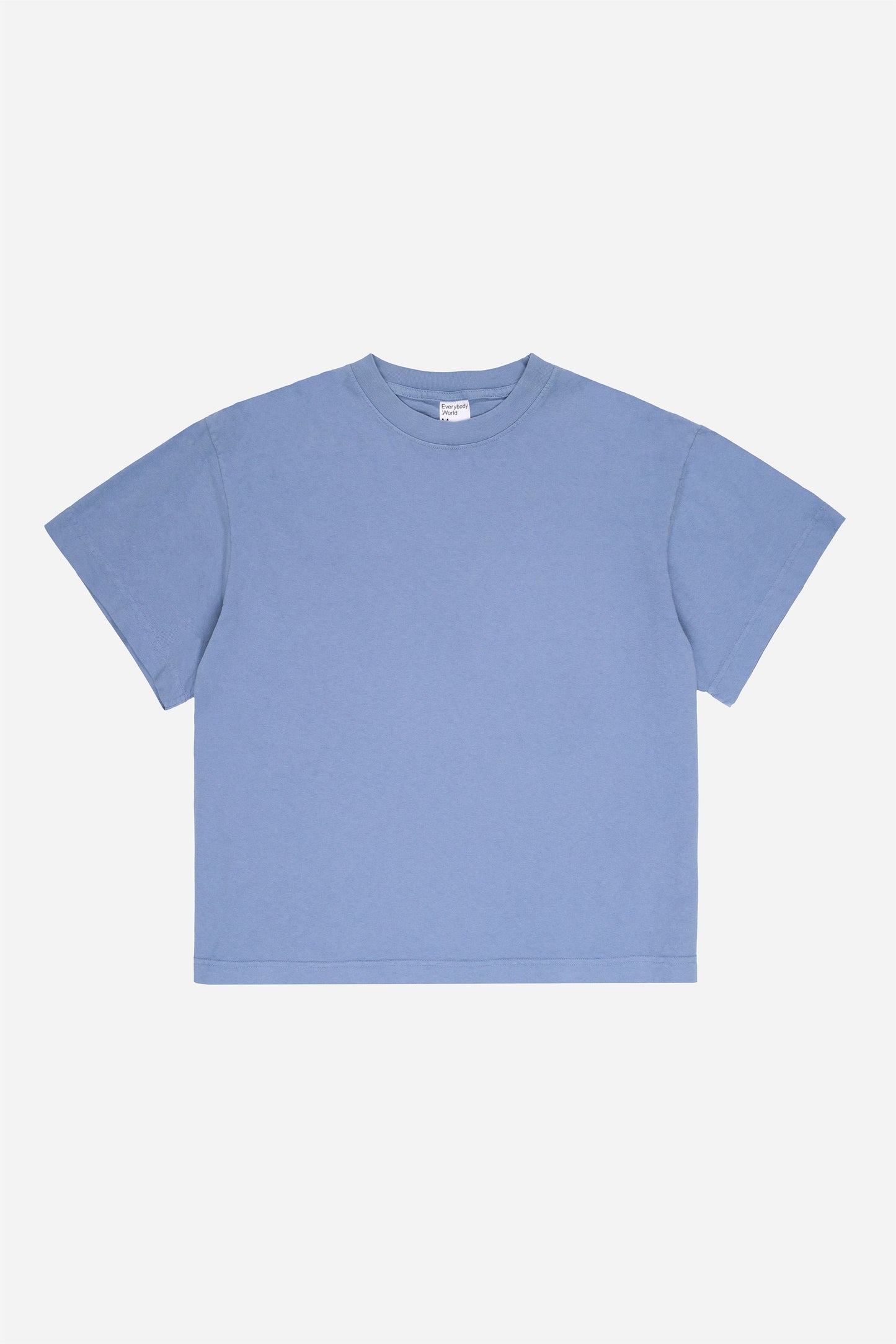 Flat lay of Periwinkle light blue-purple Boxier Trash Tee showing the cut of the t-shirt.