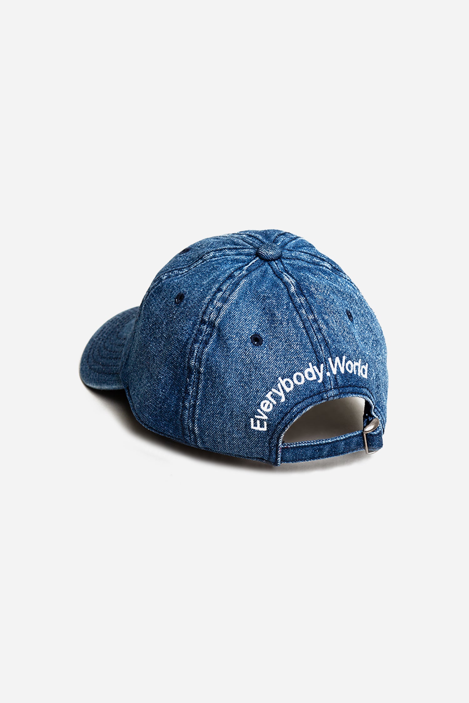 Bucky Logo Cap in Denim blue with 'Everybody,World' text embroidered in an arc above the adjustable closure. 